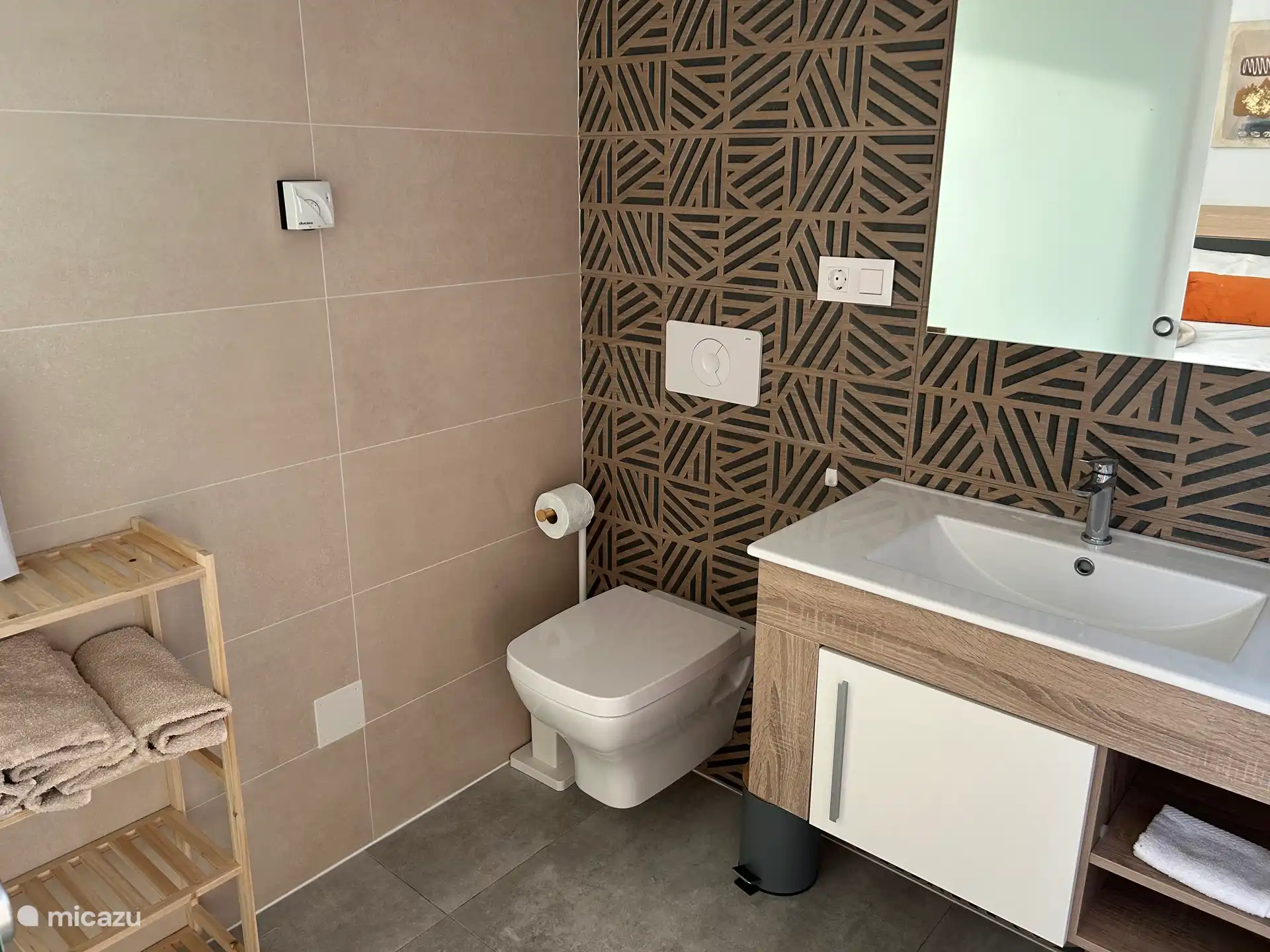 Luxurious bathroom with underfloor heating and a lovely rain shower