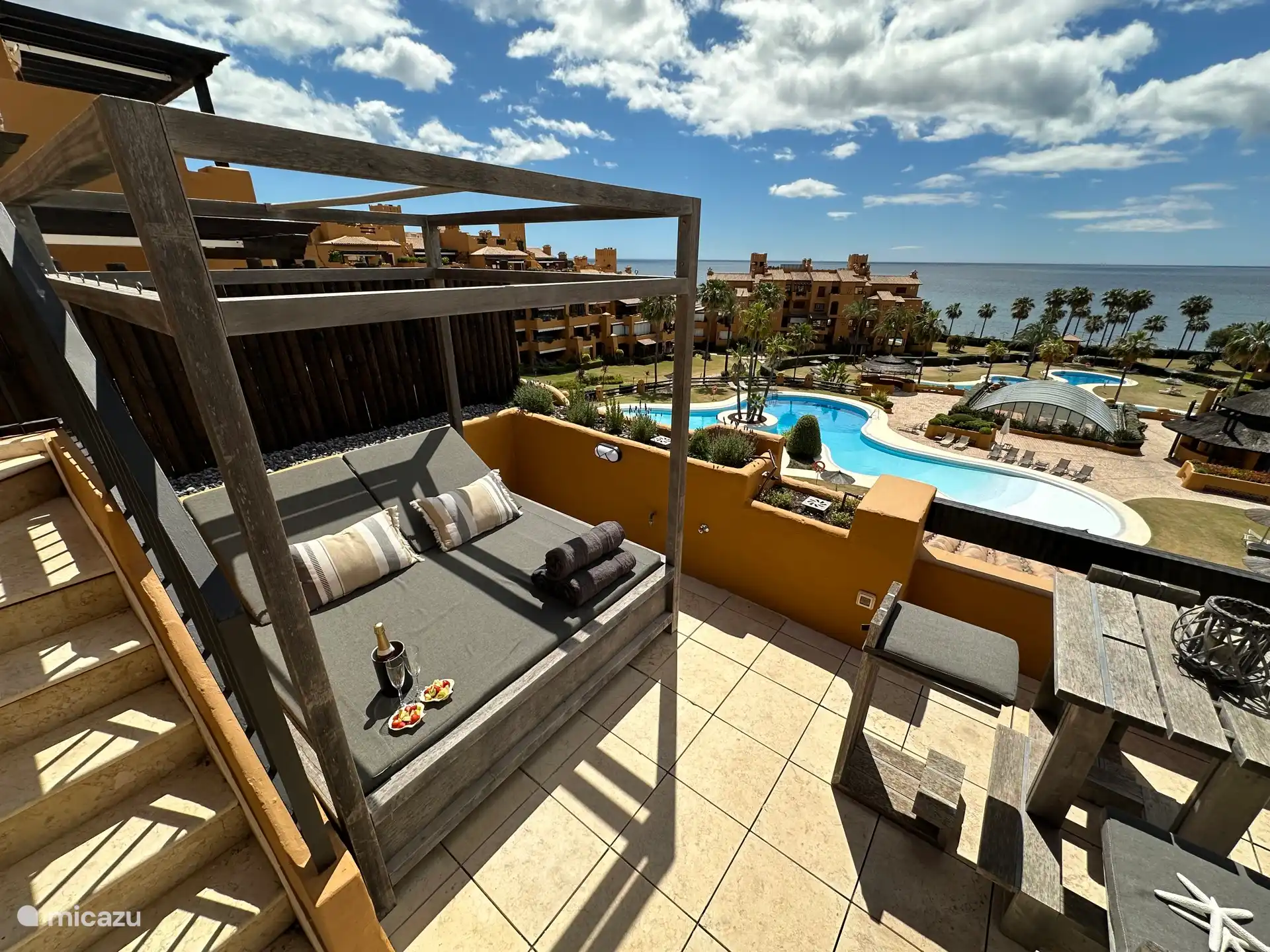 The balcony is large and fully equipped. Dining table, lounge set, sunbeds, bar table. Out doesn't even want to go down anymore.