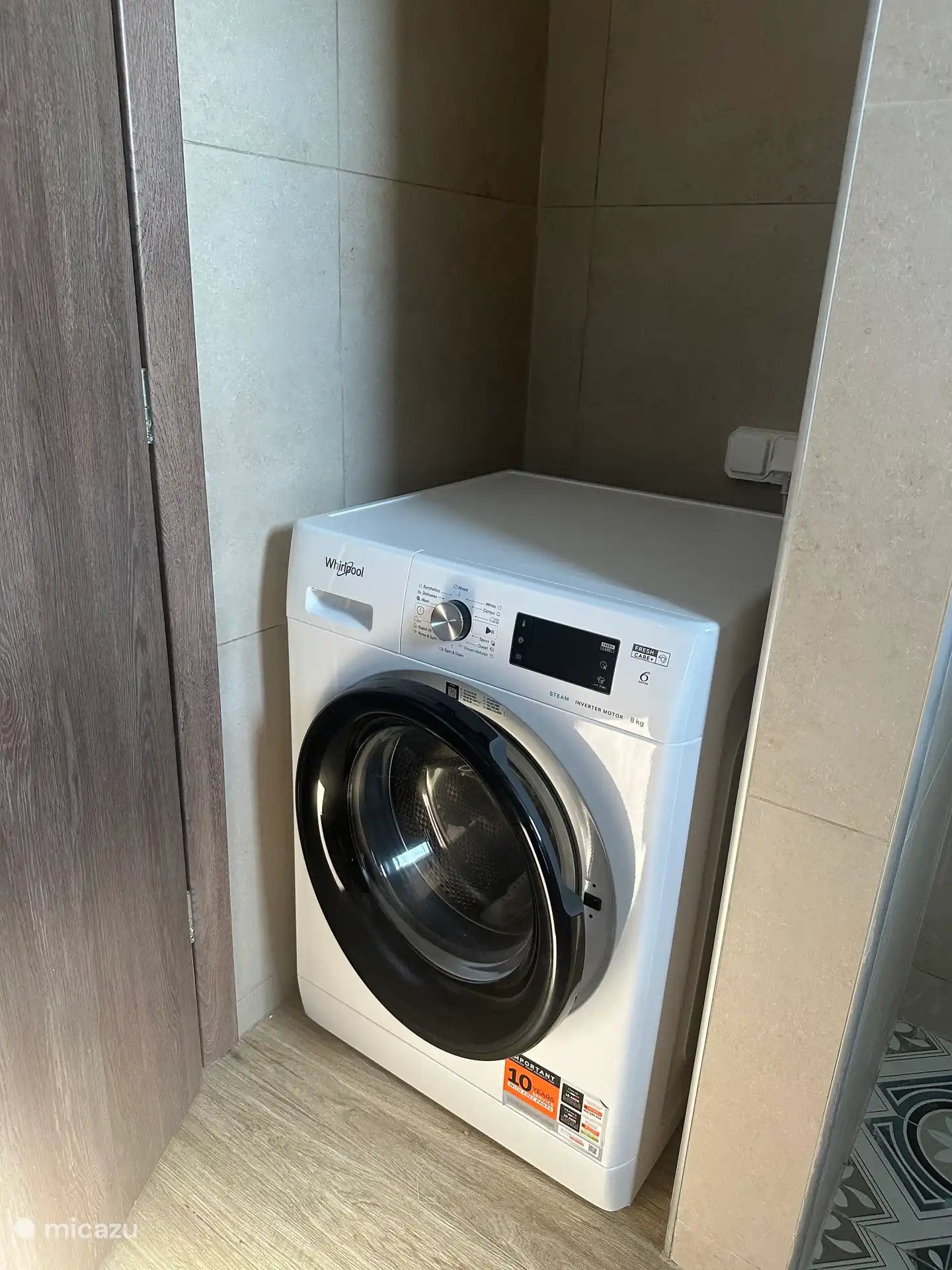 The washing machine in the second bathroom.