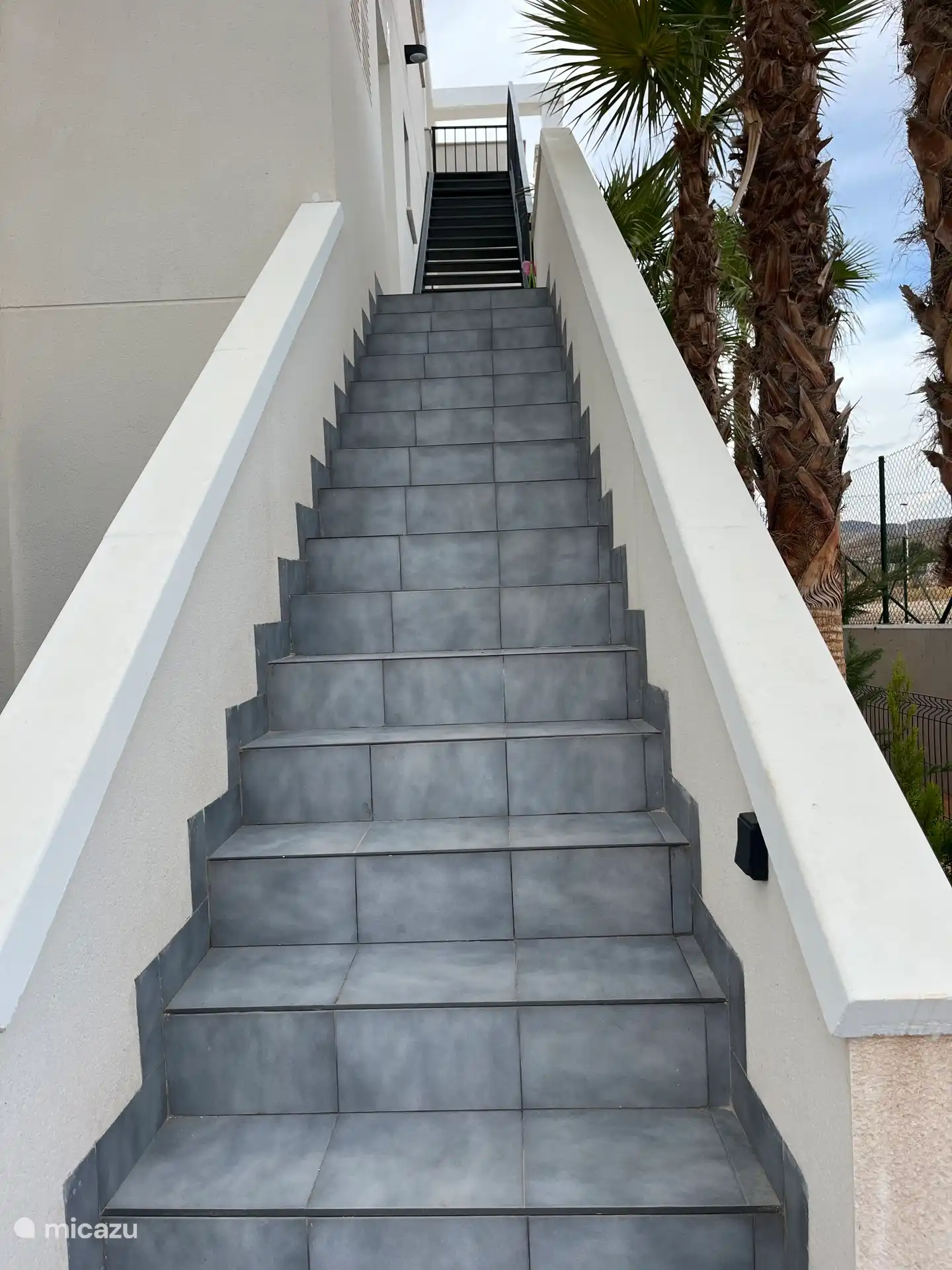 Trapt naar woning en solarium