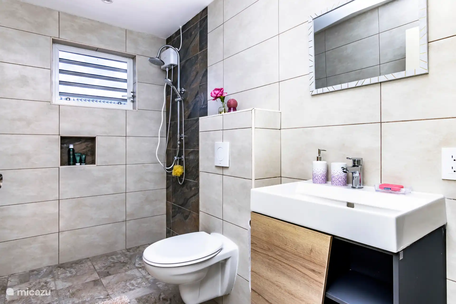 Modern bathroom with a walk-in shower and hot water