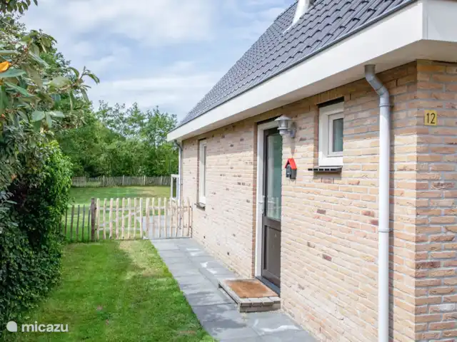 Location de Vacances Pays-Bas, Texel, Den Burgh, maison de vacances - Wulpenweid 12 De Meeuw Parking privé à la maison