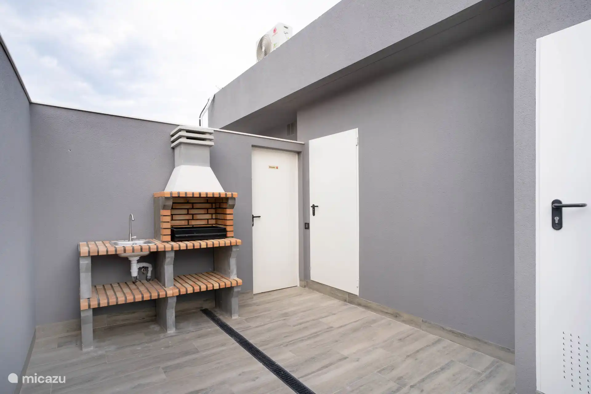 Azotea comunitaria con barbacoa