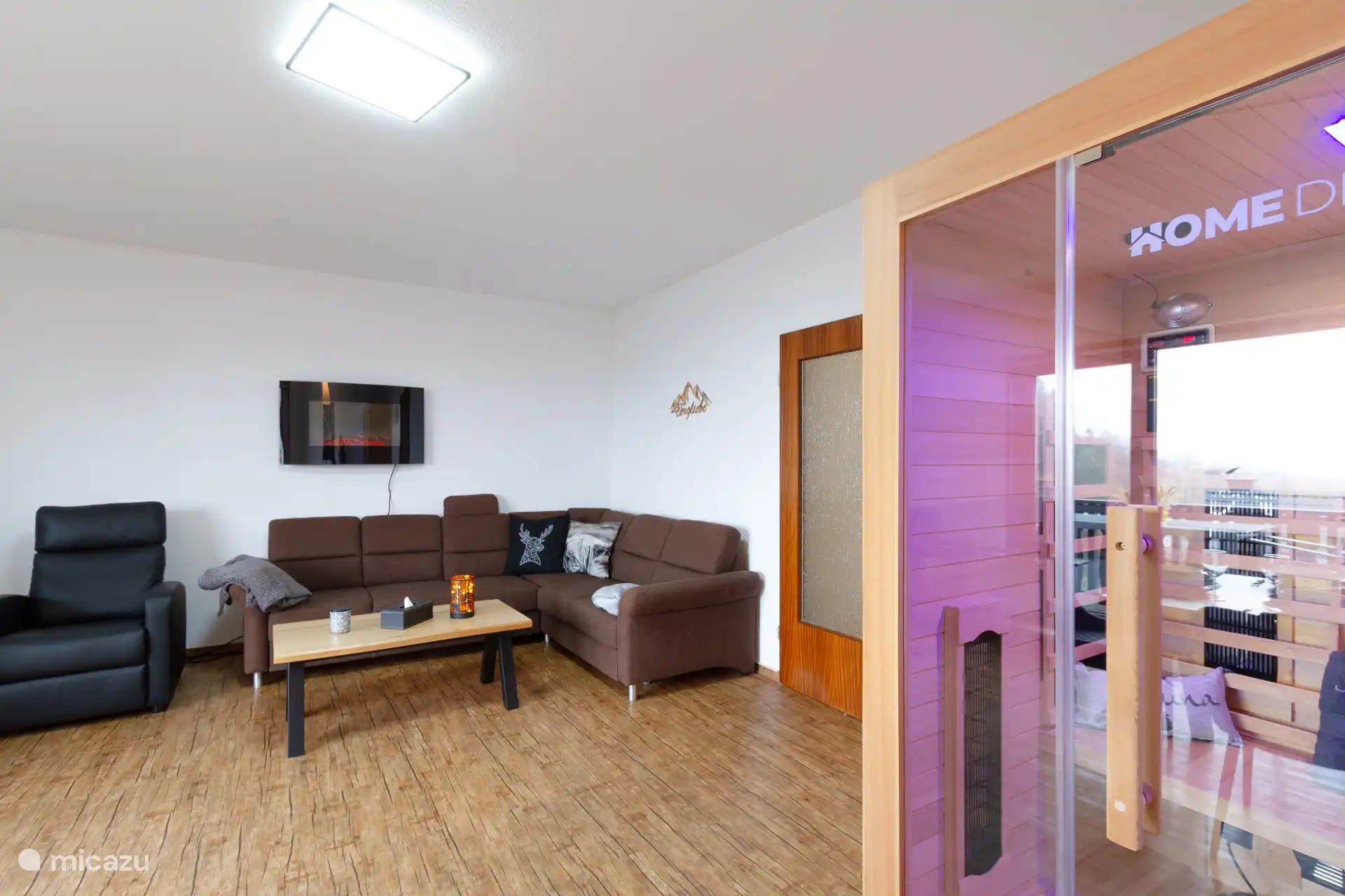 Living room with electric fireplace and massage chair 