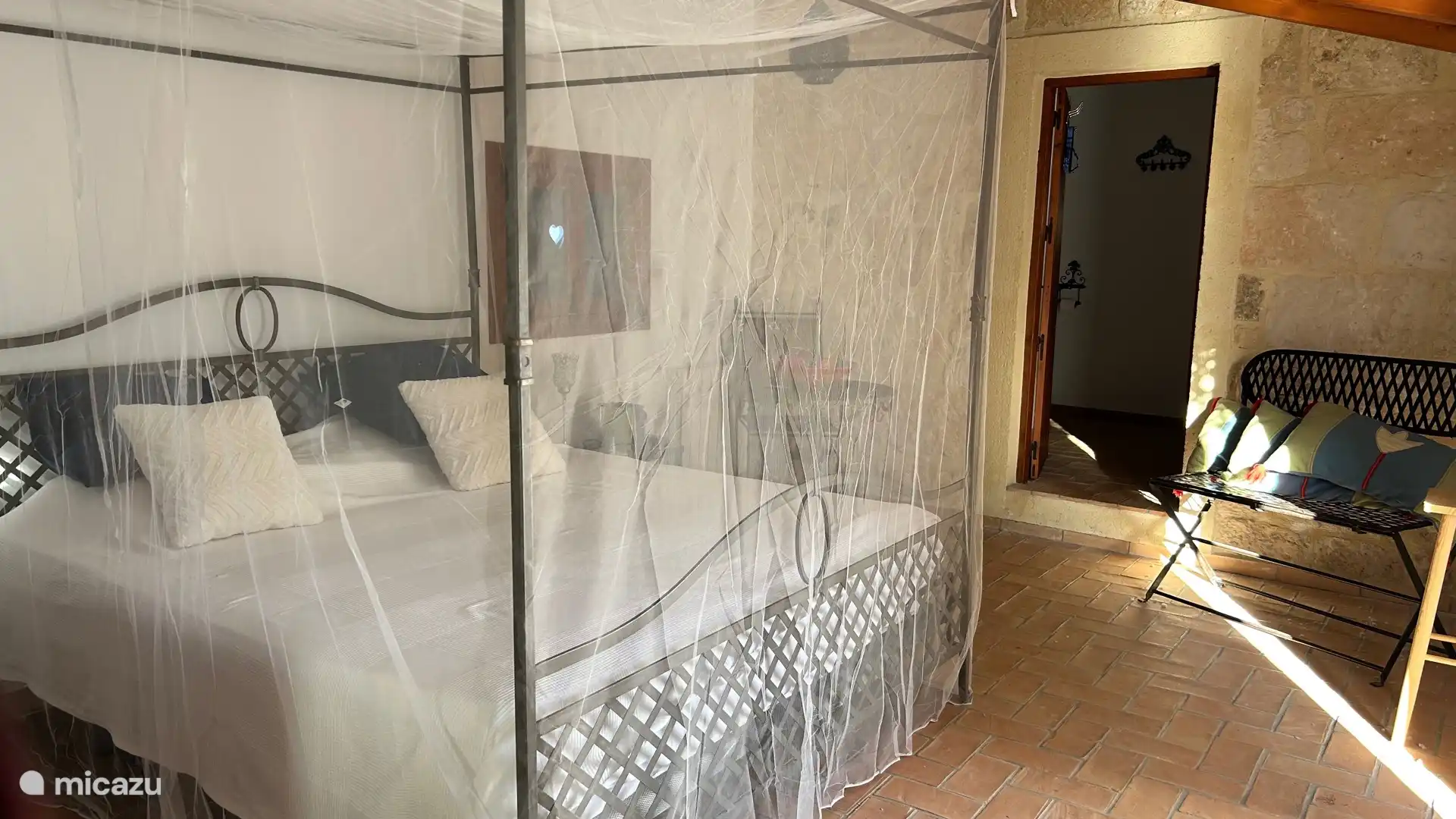 Bedroom (no. 5) with adjoining bathroom. This bedroom is accessible from the side of the house