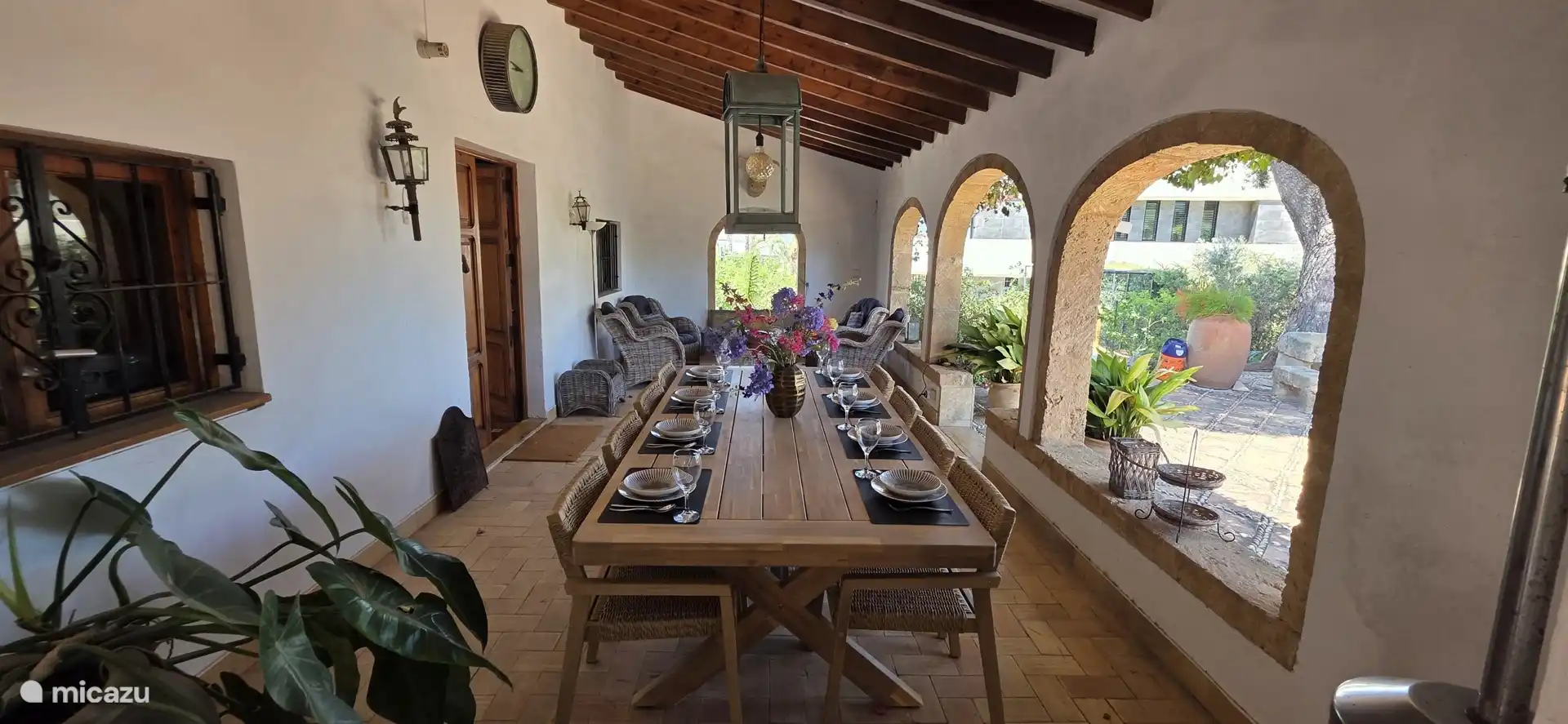 Dining table and lounge seating area in the front naya