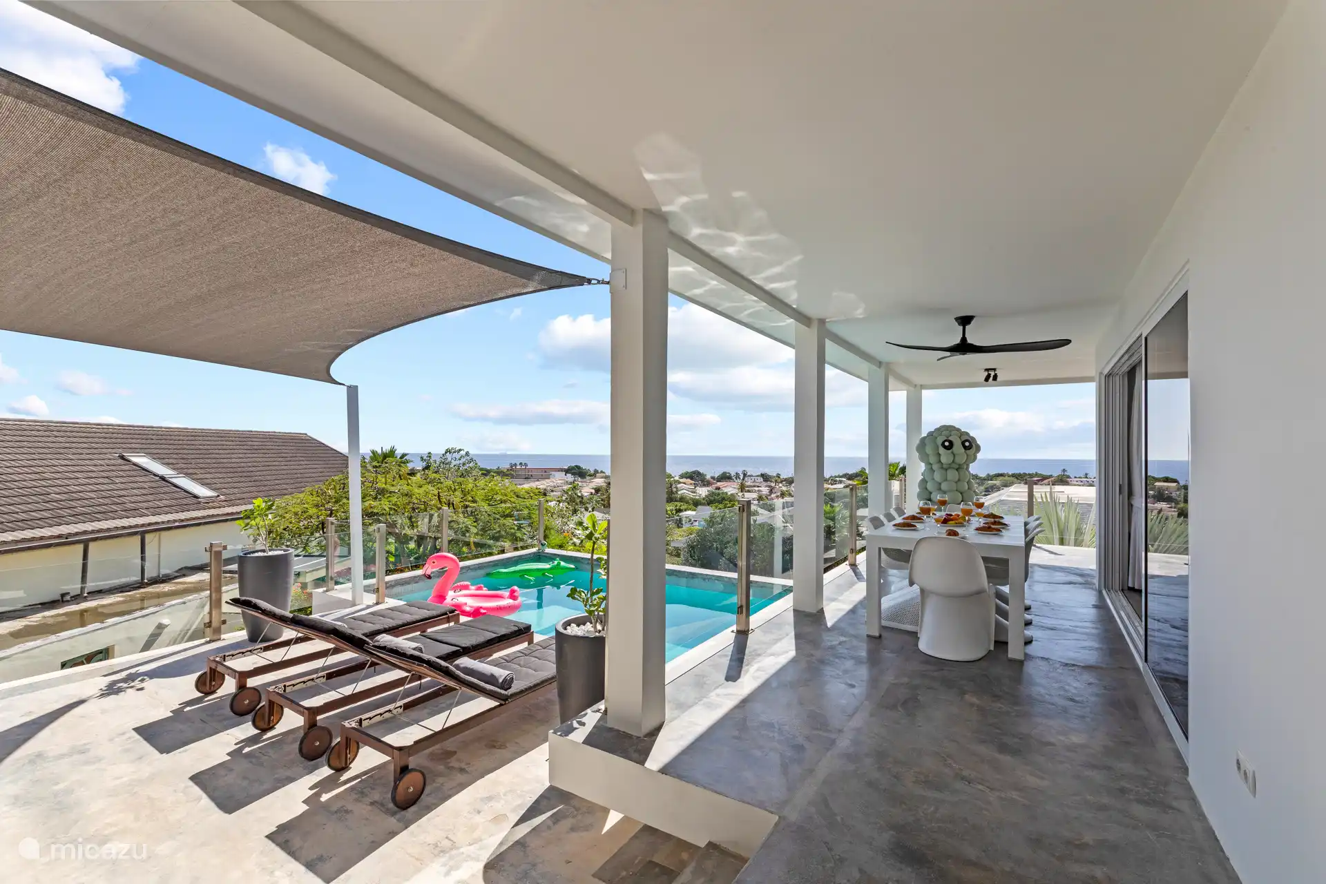 The villa has a spacious covered outdoor area.