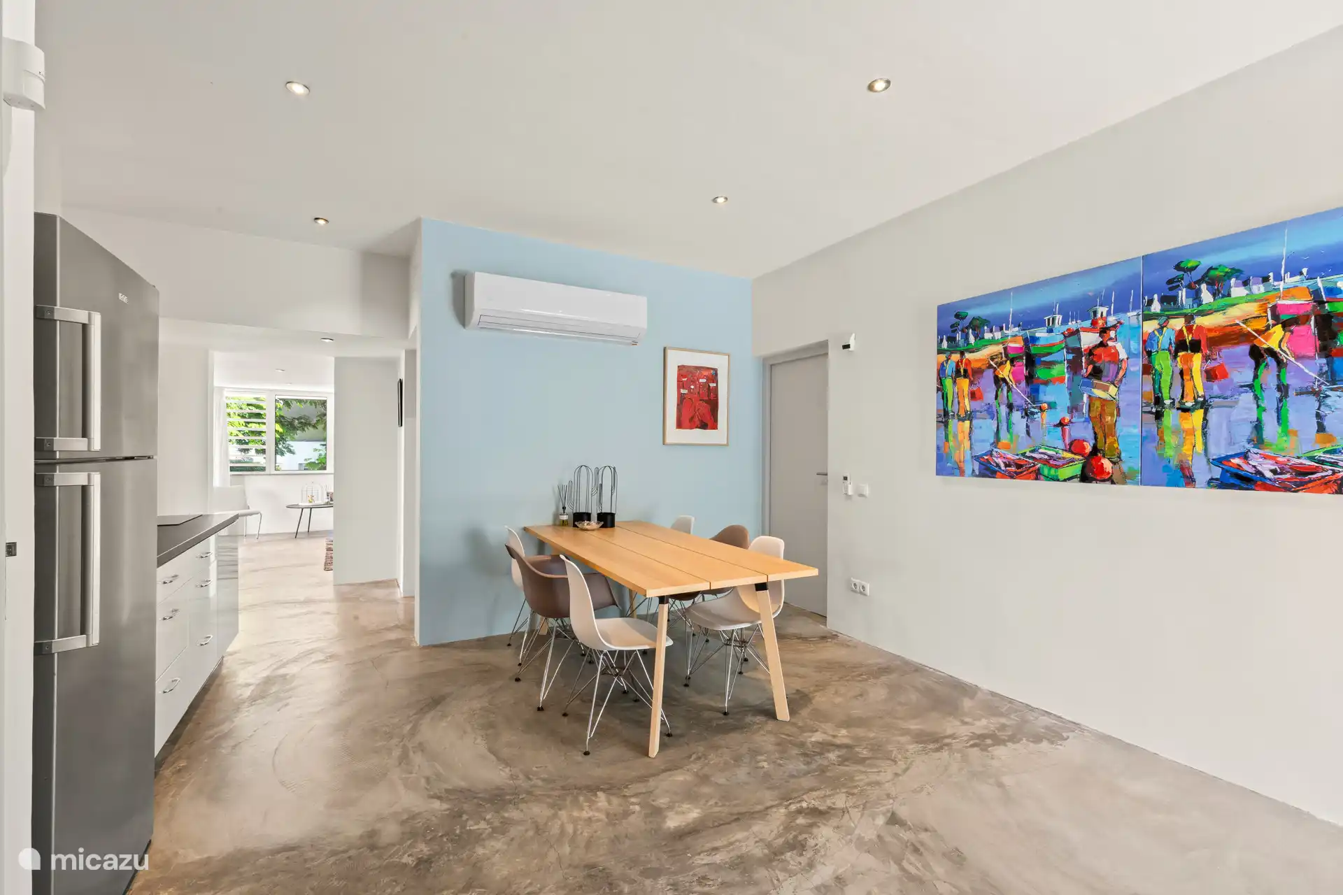 Dining table for 6 people by the kitchen in the apartment.
