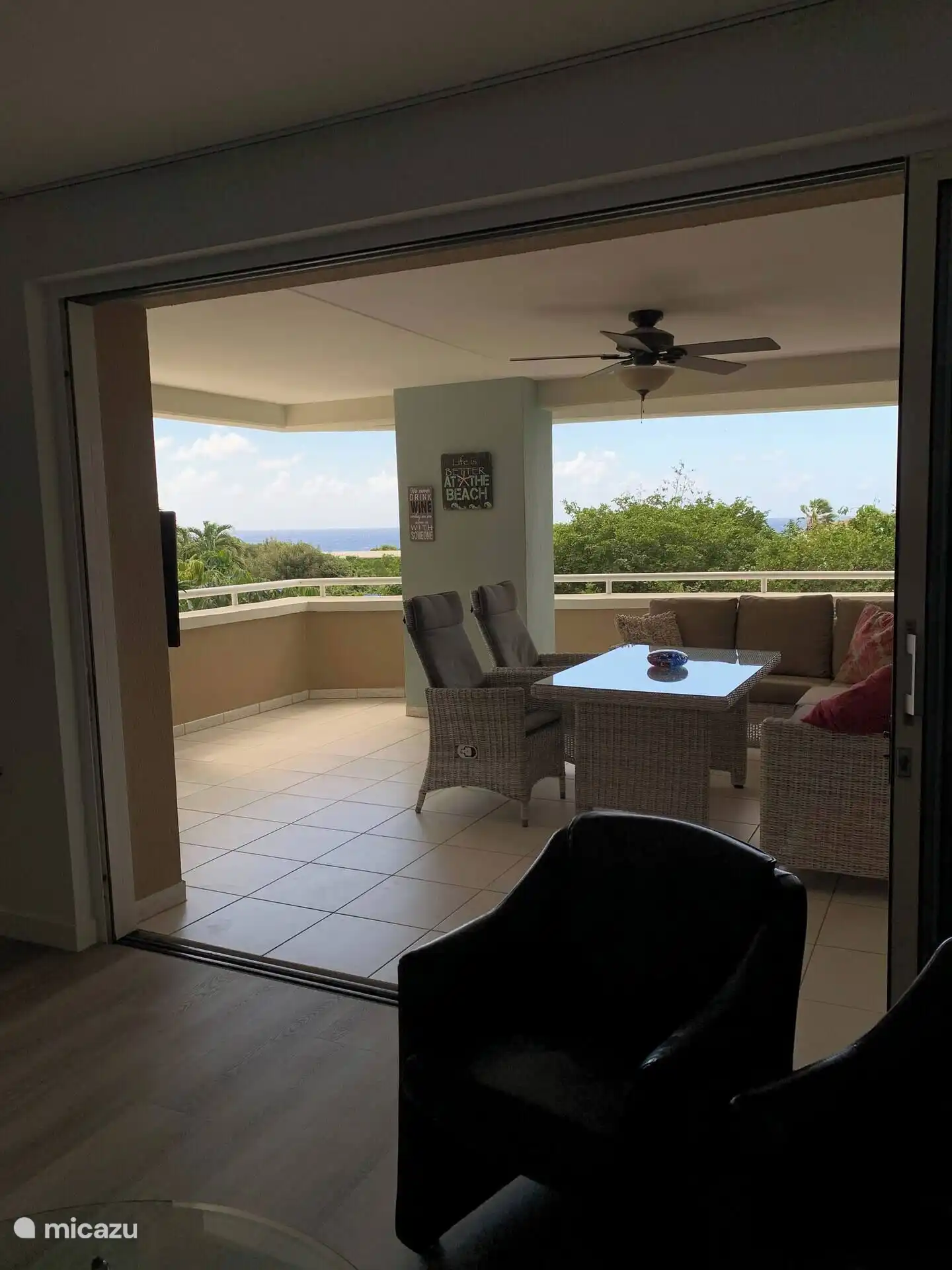 View from the living room on terrace. Green and sea