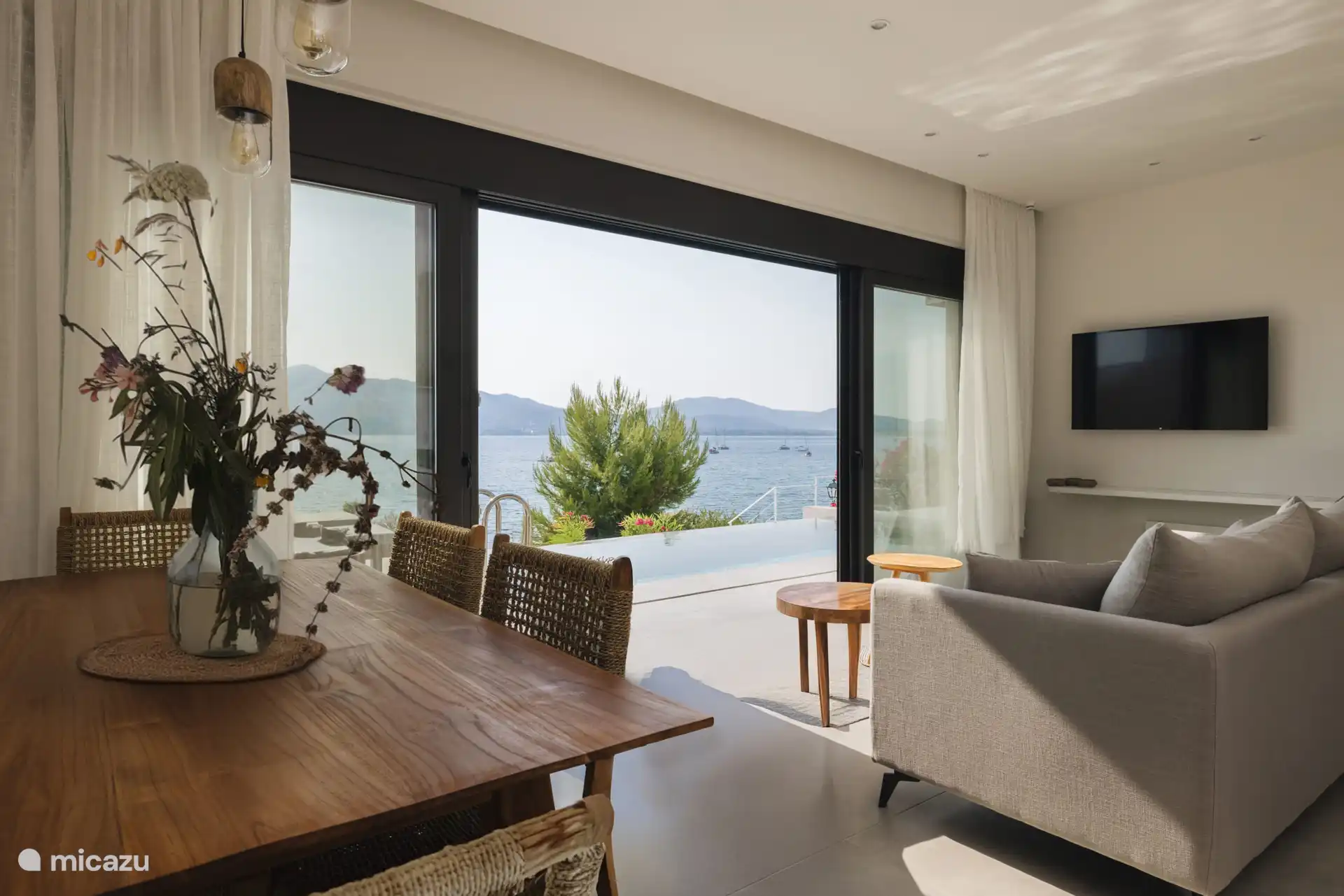 The serene view of the Ionian Sea and the many sailing boats coming and going to Paleros harbor