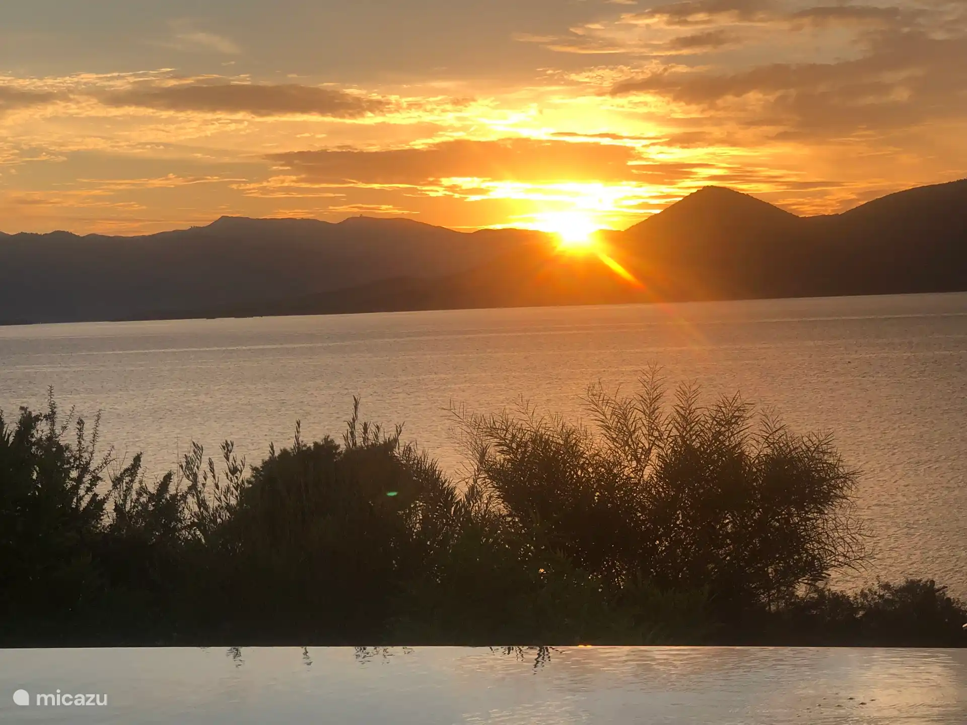 From the pool, having a drink, watching the sun go down..