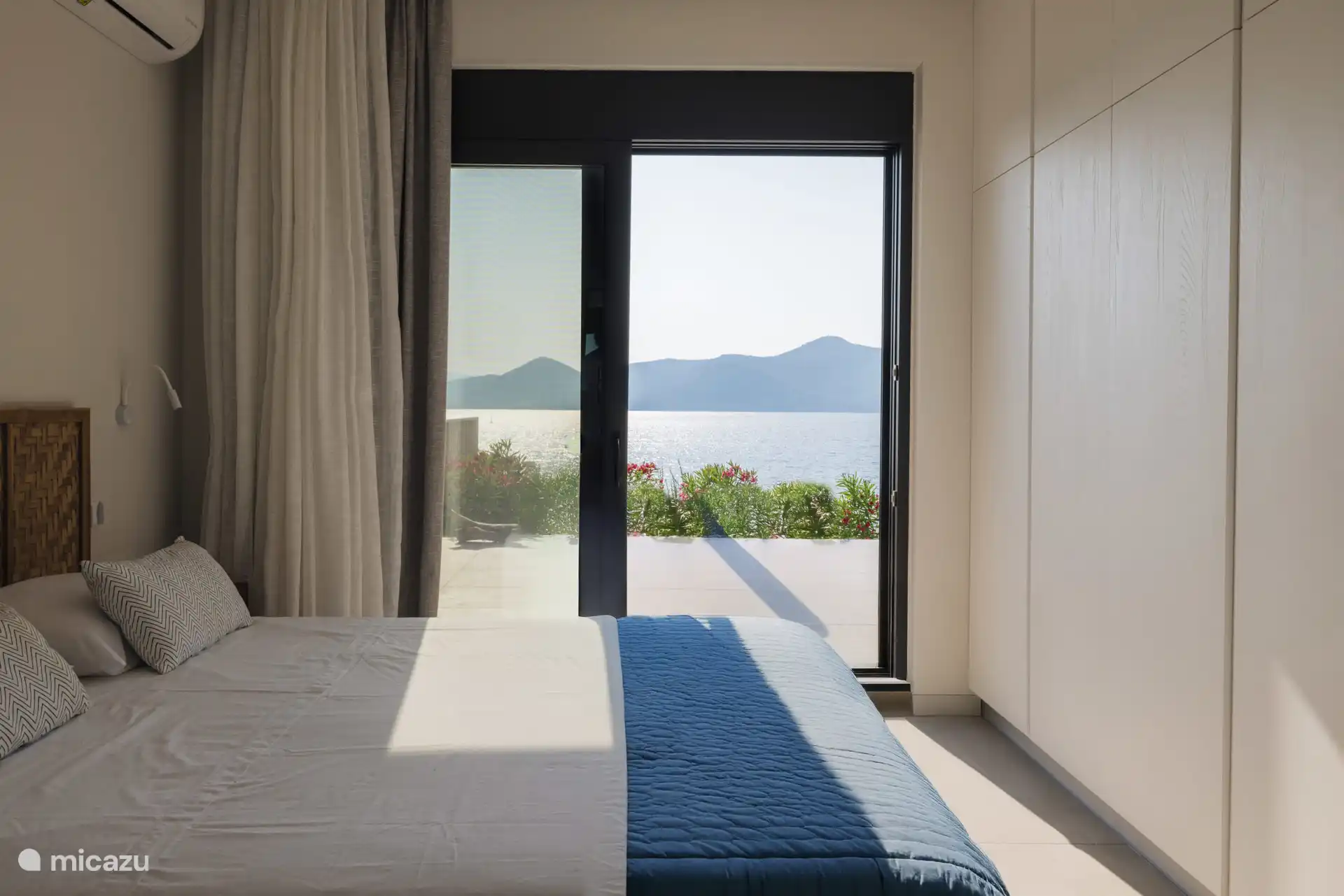 Master bedroom with the amazing view of the sea and the Lefkas mountains