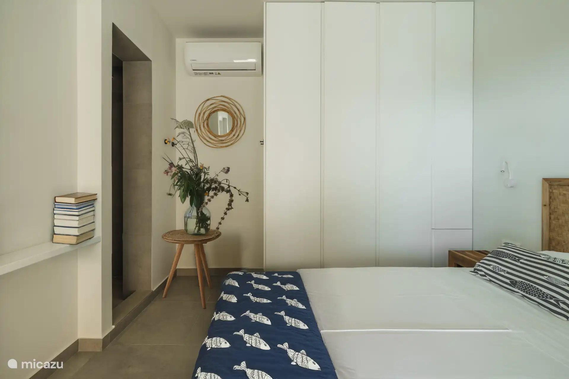 The other guest room with its own shower and the Queen bed