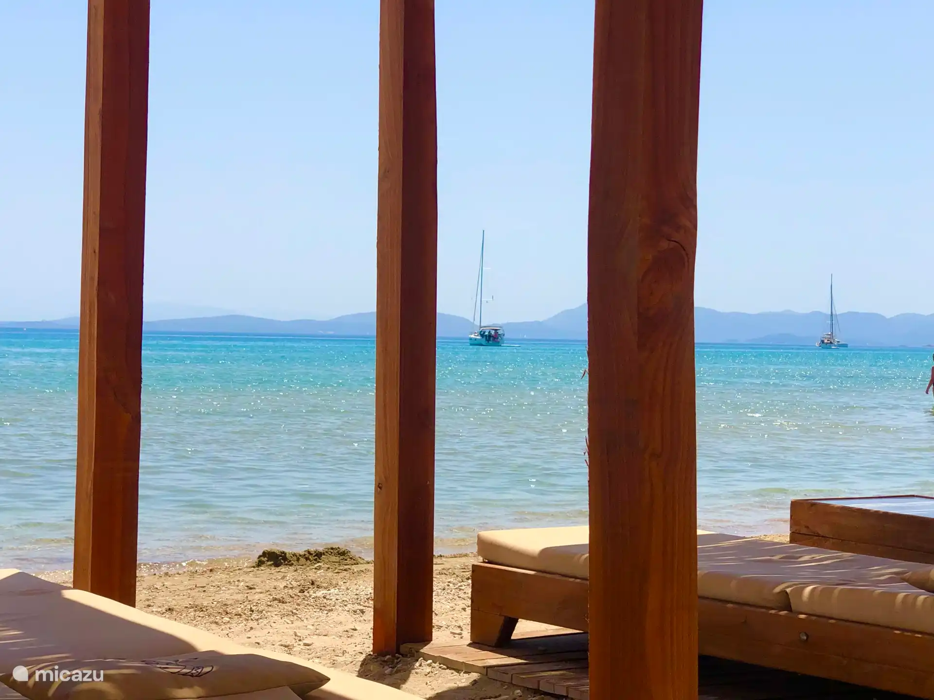 Enjoy a cocktail while watching the sailing boats pass by