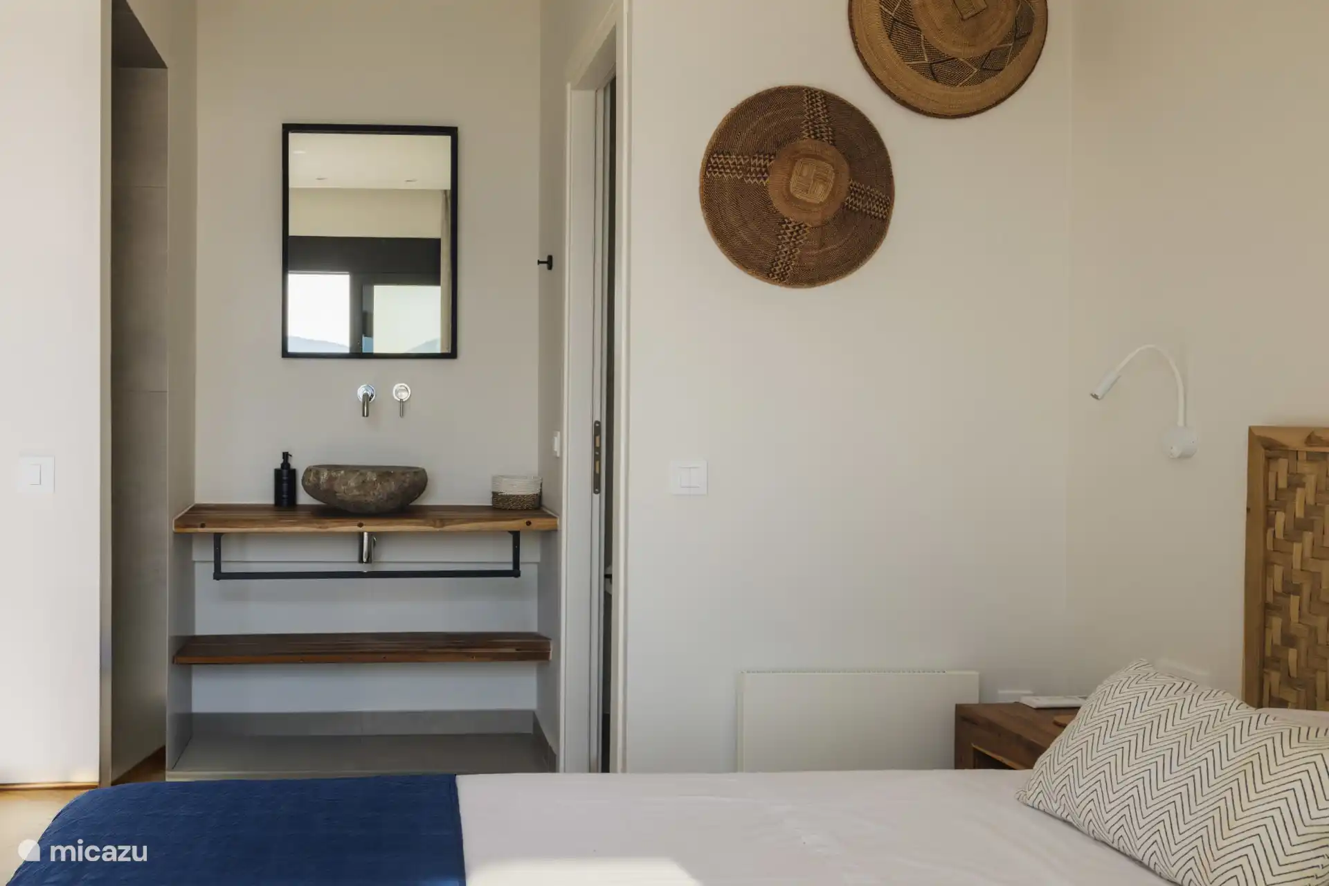 Master bedroom ensuite bathroom with separated toilet.