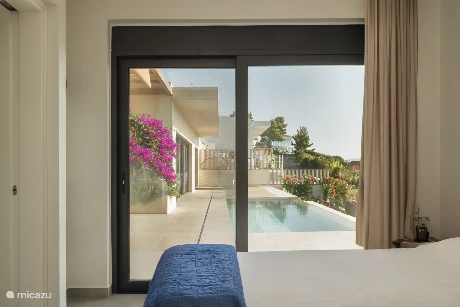 The guest room with the 2 single beds and direct access to the pool area