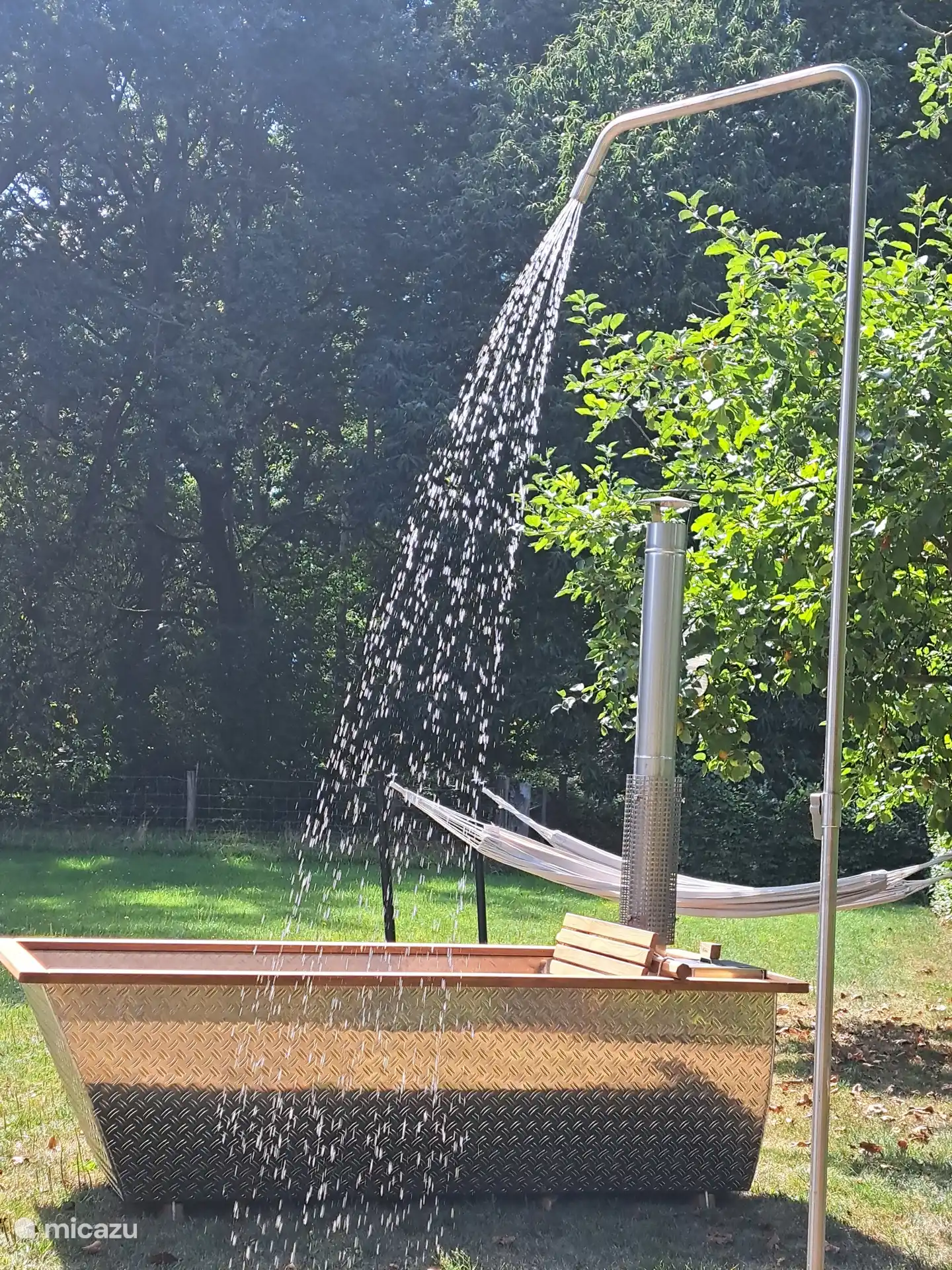 hot tub with outdoor shower