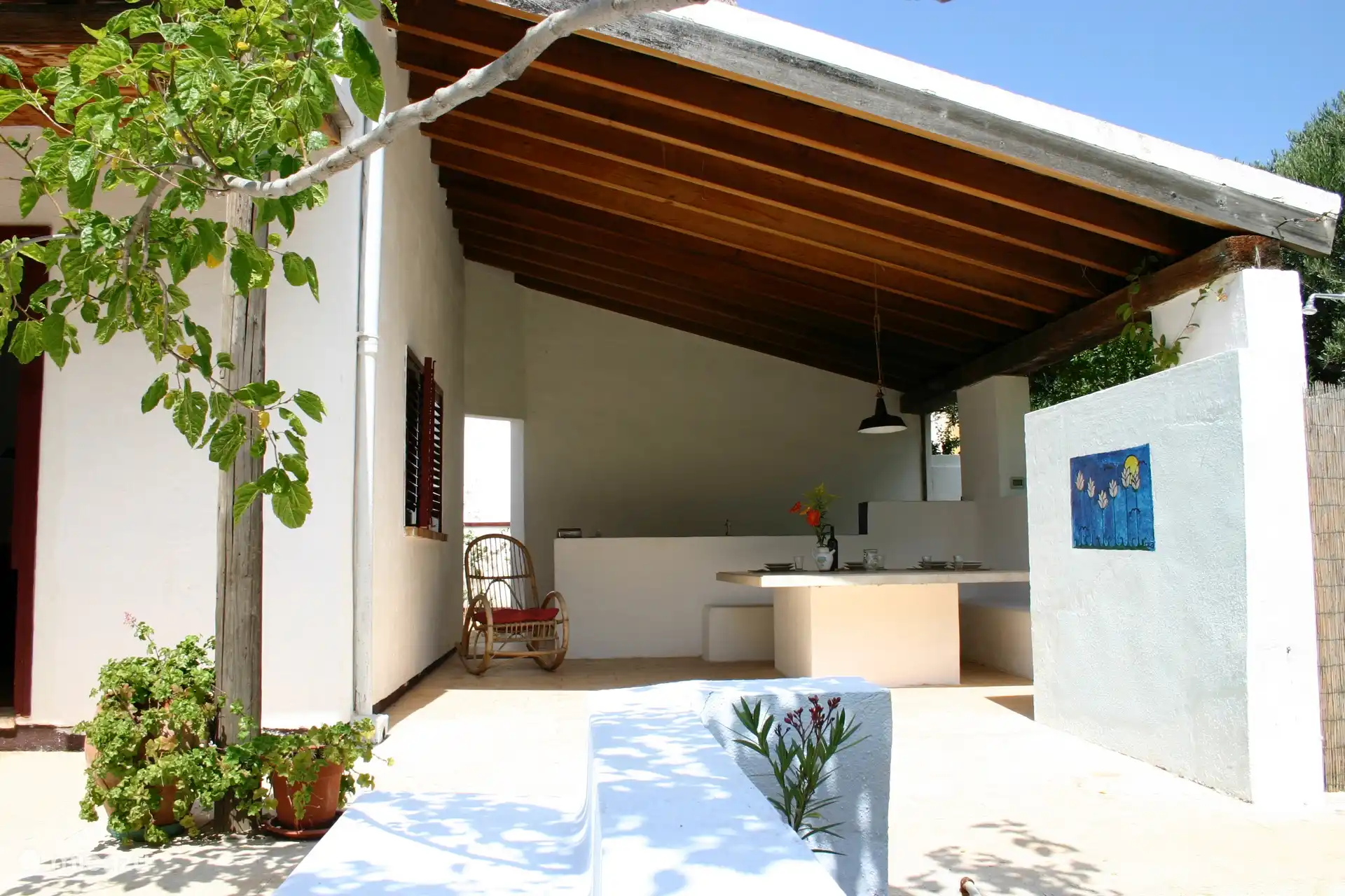 The covered outdoor terrace with large marble table. Ideal for summer lunches and dinners.