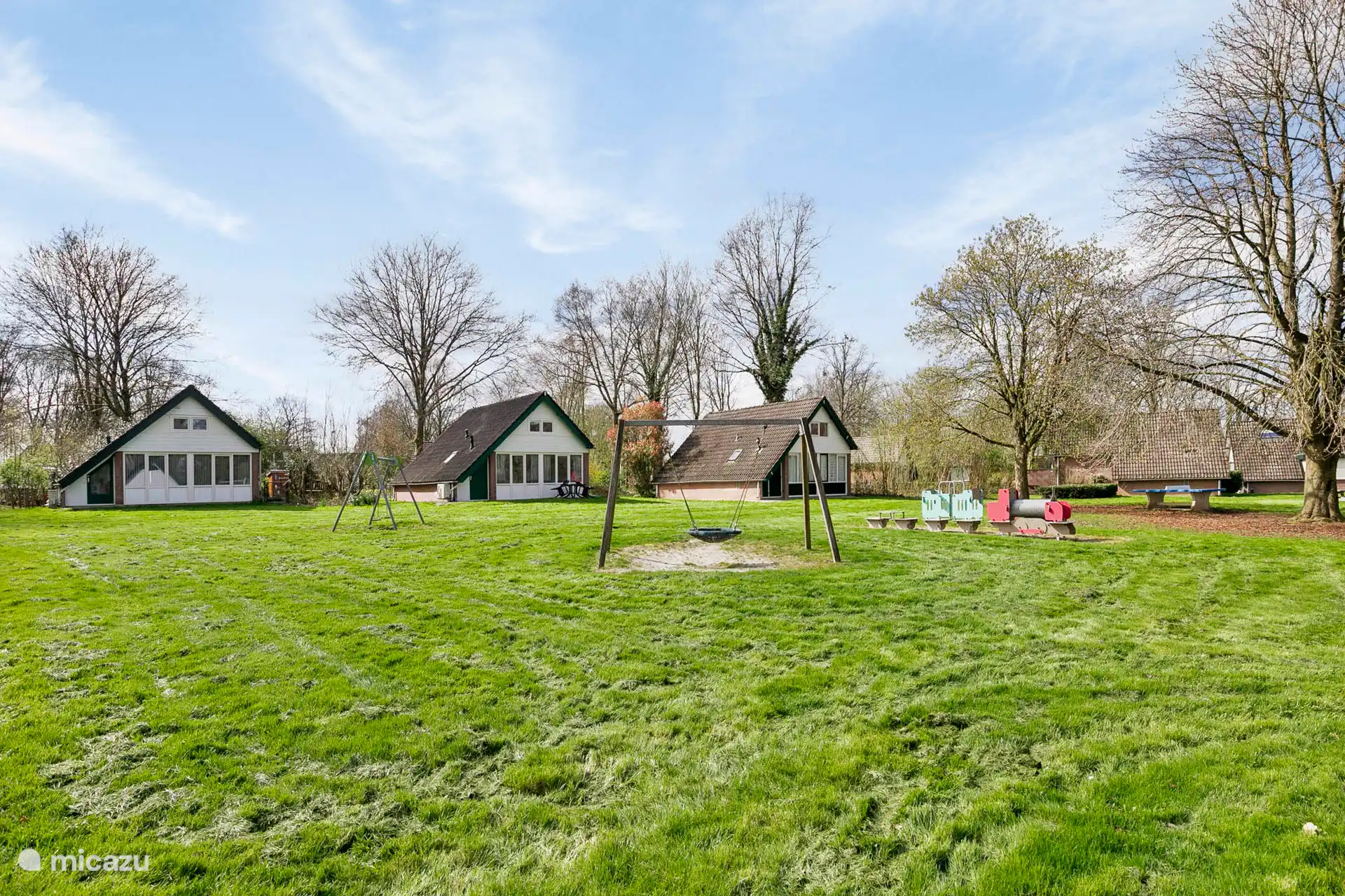 View of playground from cottage and terrace. 