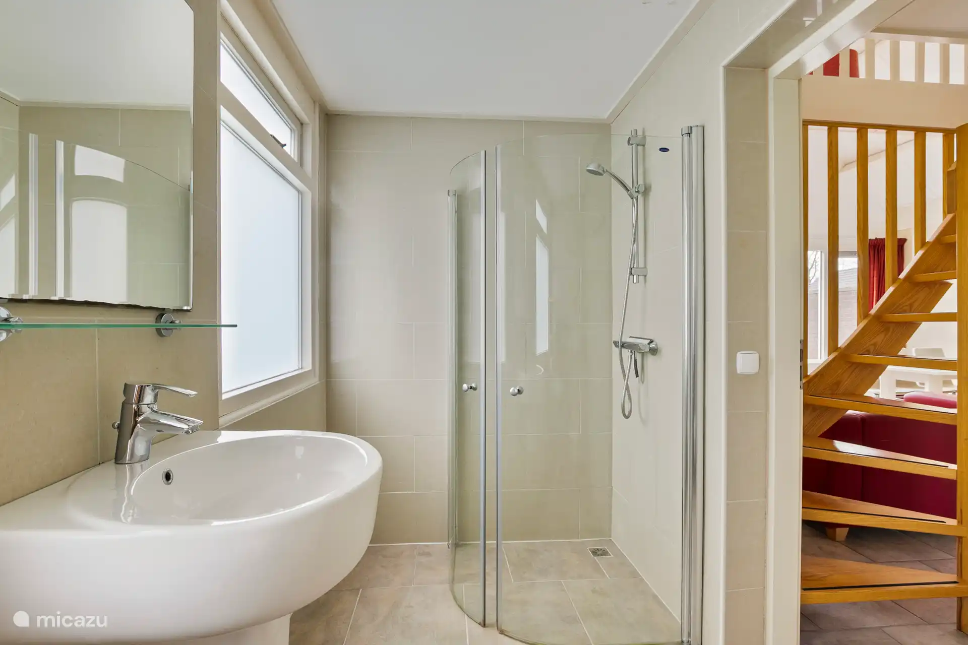 Bathroom with walk-in shower, extra toilet and sink. 