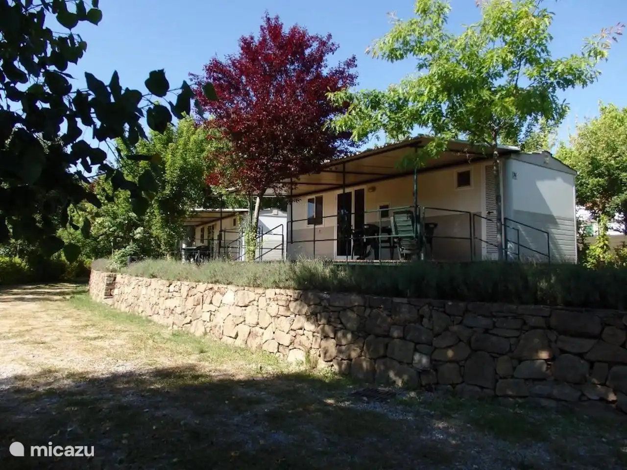 Surroundings mobile home with covered veranda
