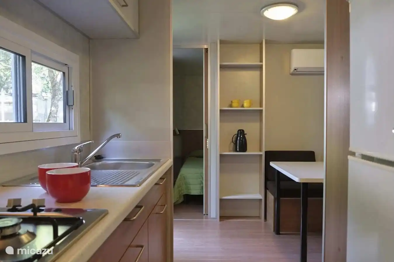 See-through kitchen to living-dining area and bedroom I