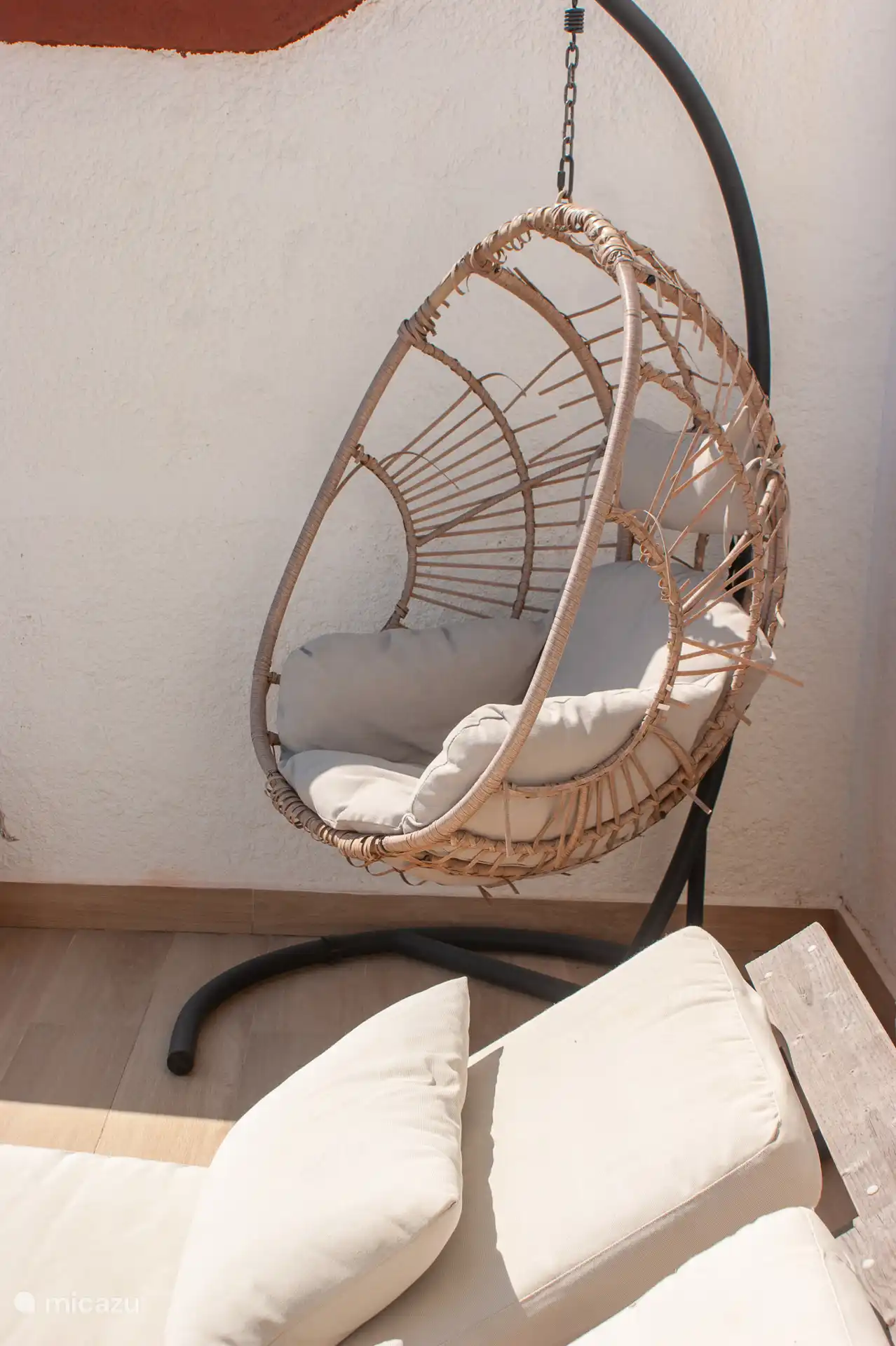 Balcony with hanging chair