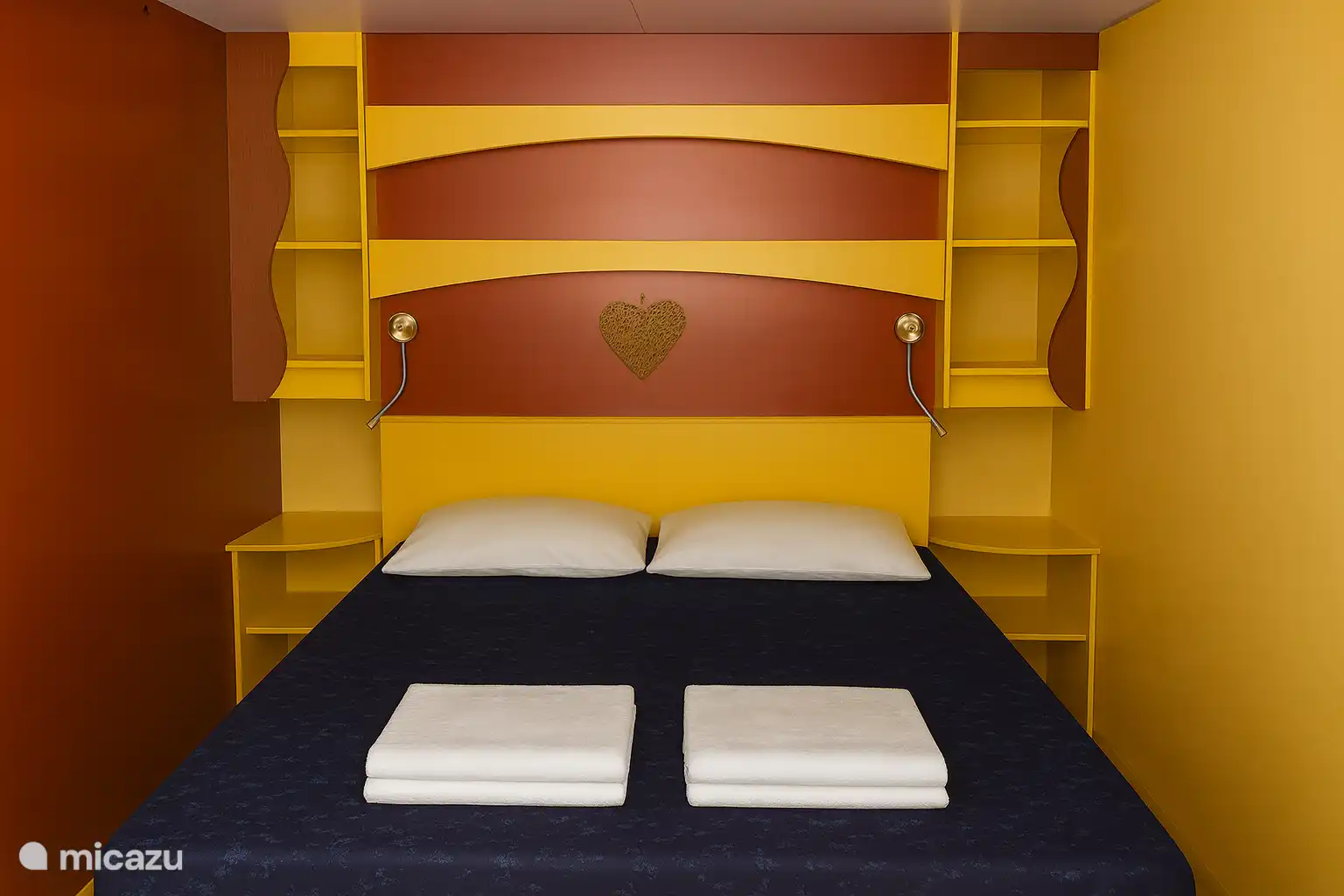 Comfortable bedroom with double bed and practical storage space