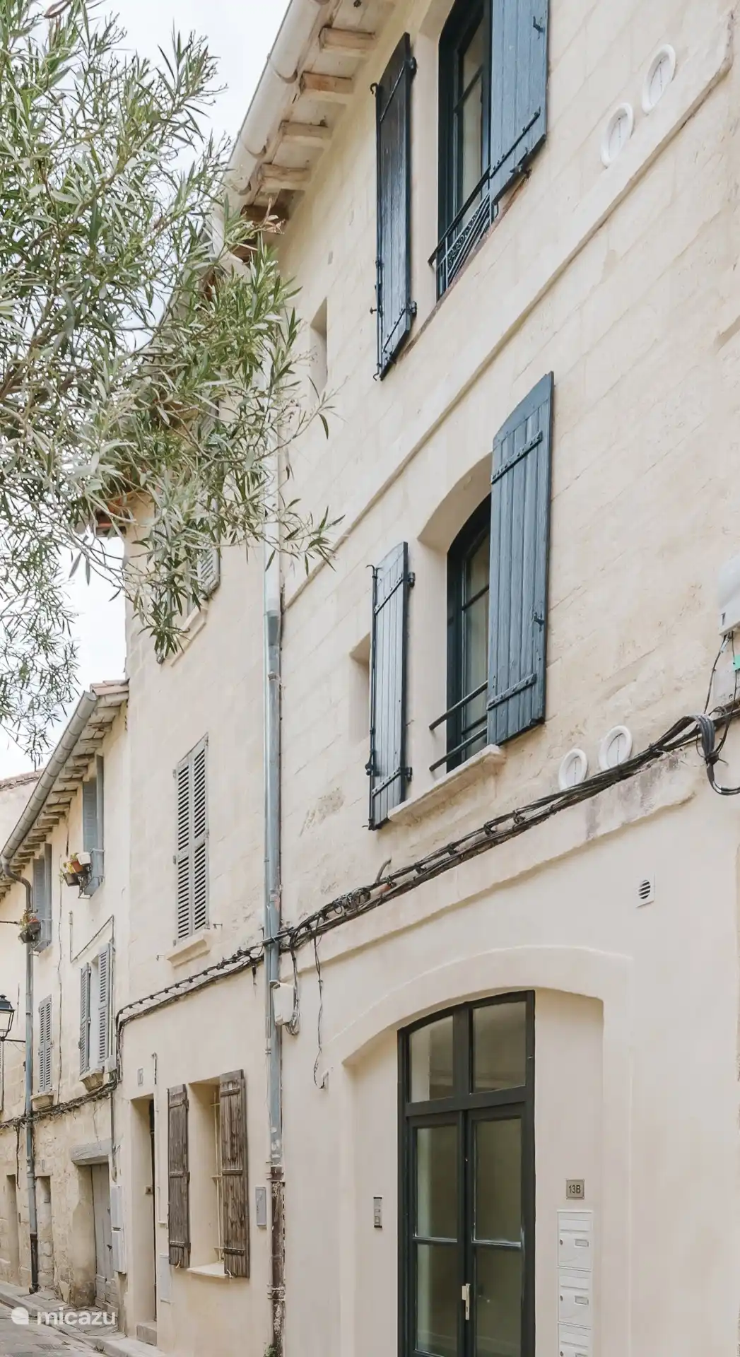 Characteristic façade of the building decorated with rampart stones.