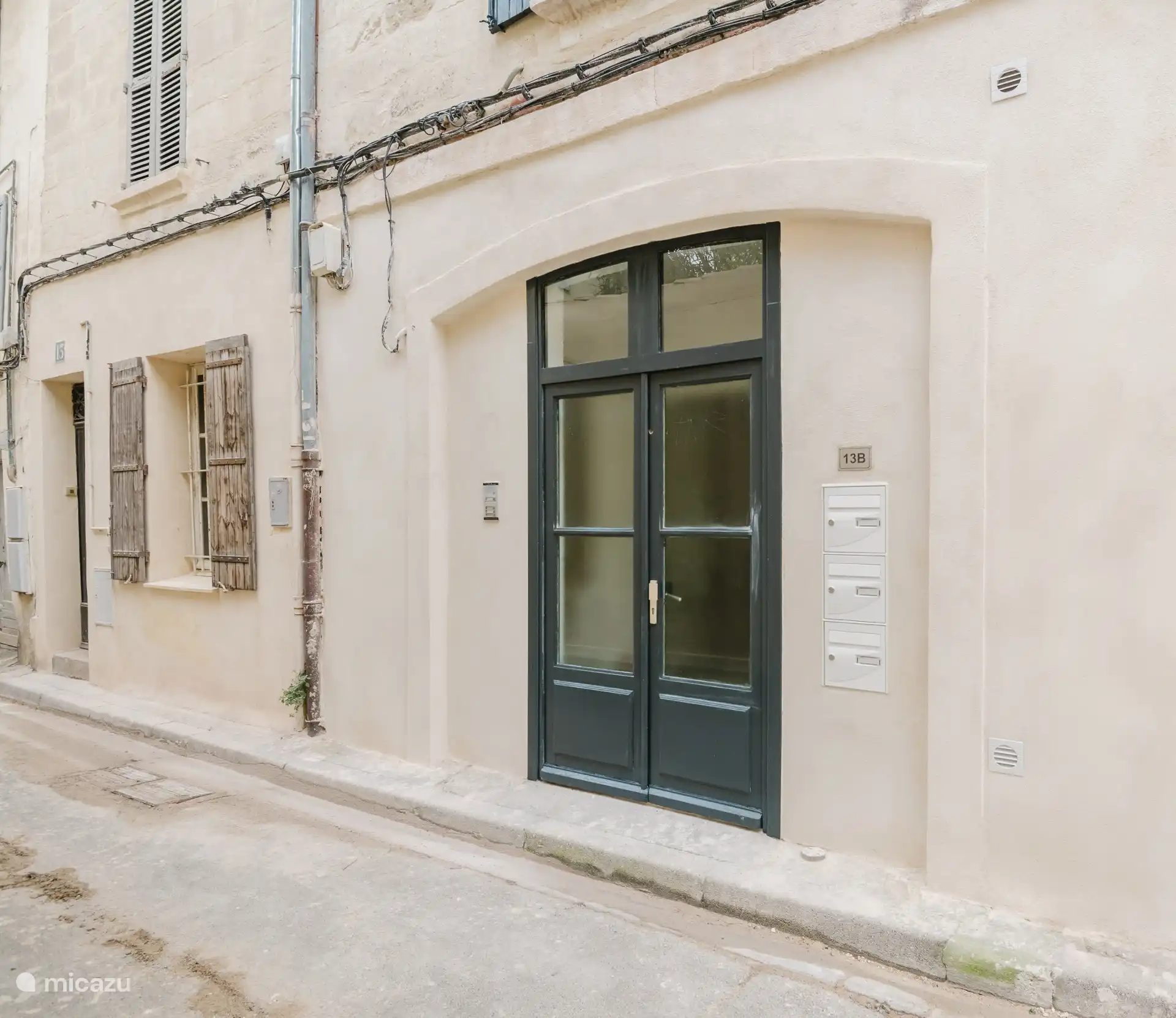 Facade of the building with its elegant front door.