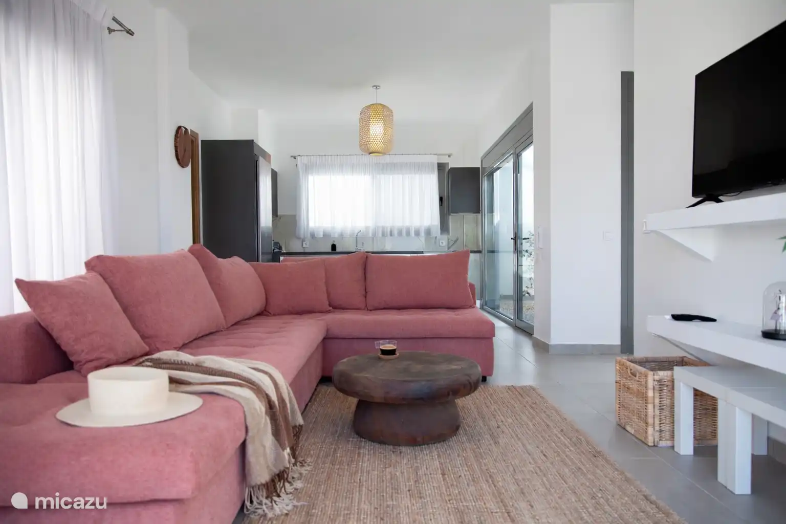 comfy corner sofa with kitchen in the background