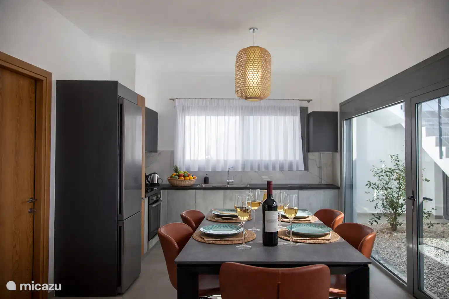 Open plan kitchen with dining table 