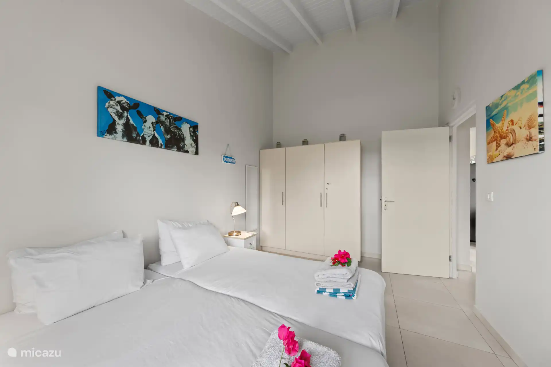 Bedroom 2 with air conditioning and wardrobe.