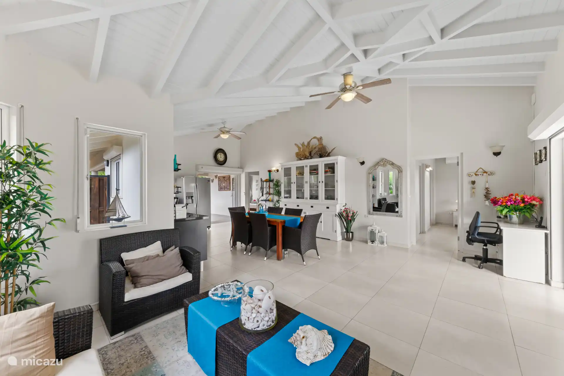 There is a workplace available in the living room.