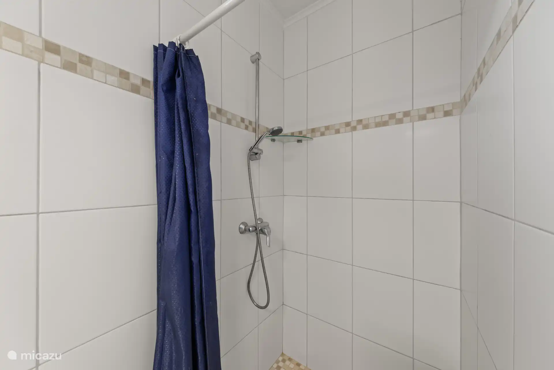 Bathroom in the master bedroom with shower, toilet and sink.