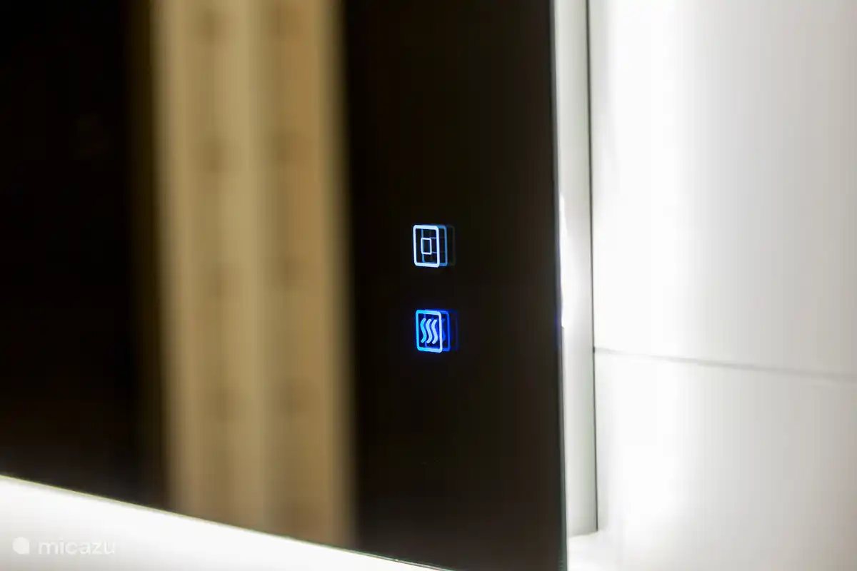 Espejo calefactado en el baño