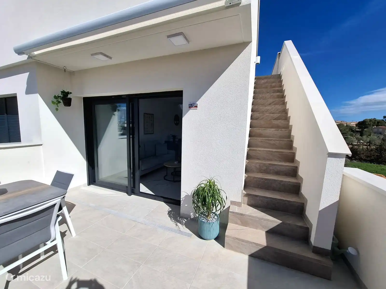 from the balcony with the stairs to the private roof terrace / solarium