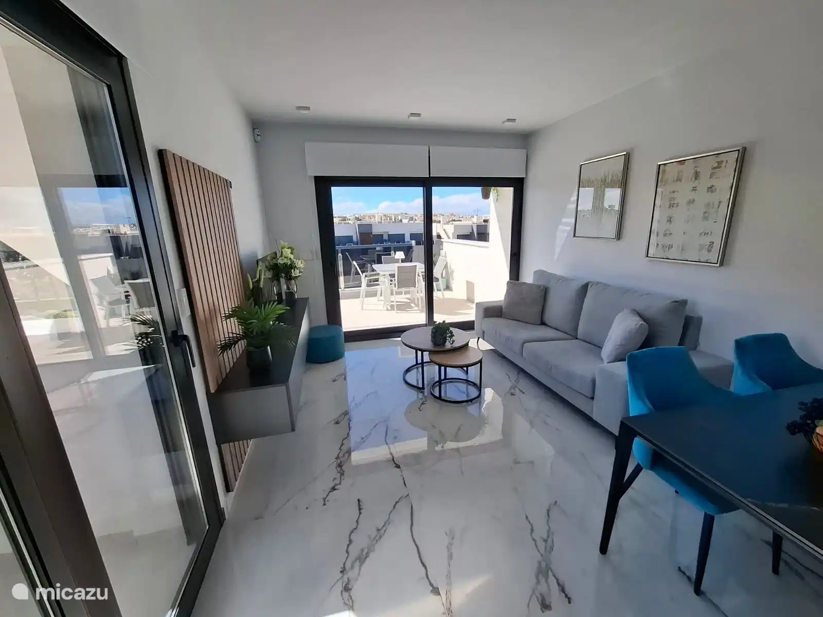 Spacious living room with a view of the balcony