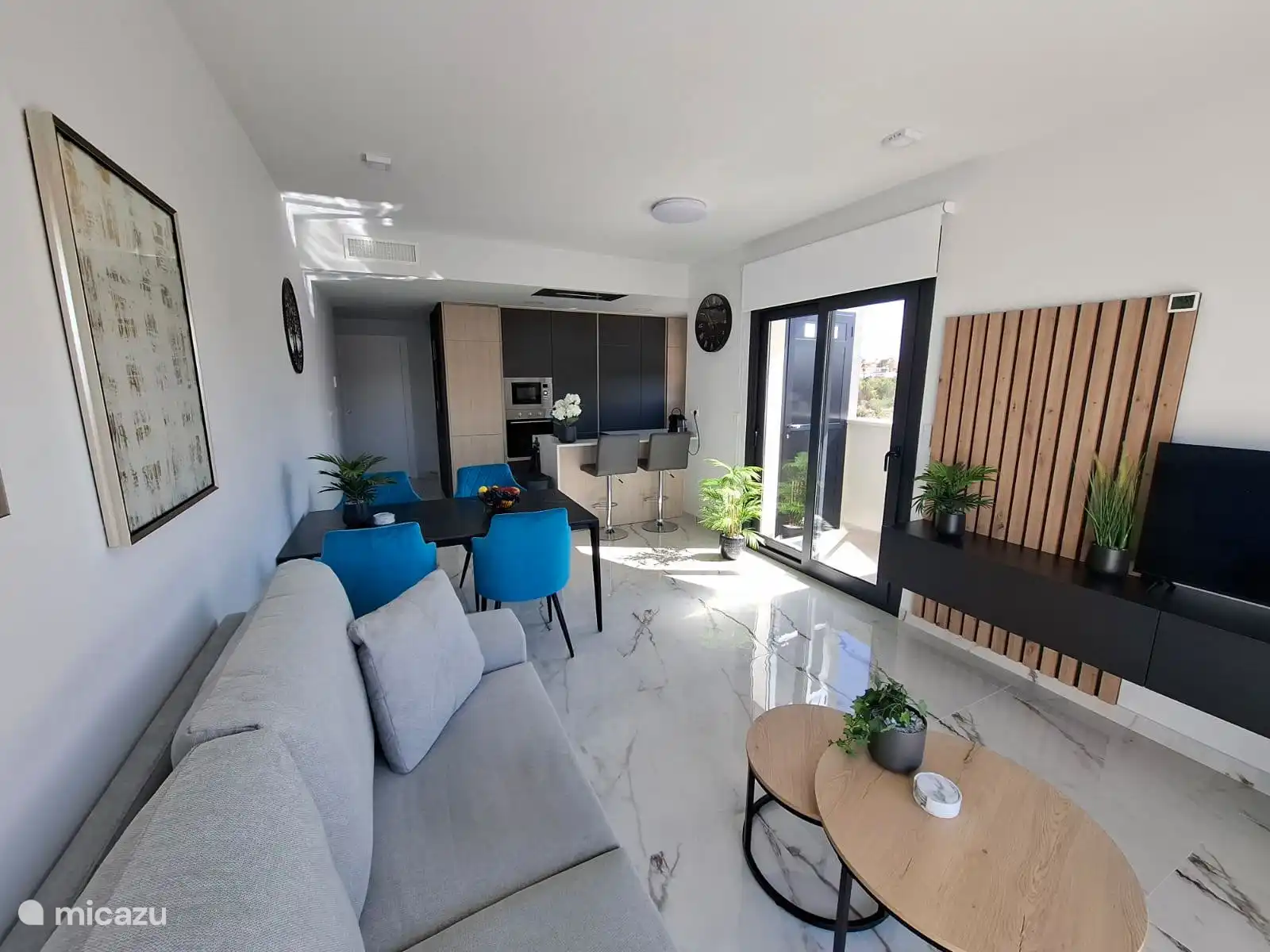 spacious living room with a view of the spacious open kitchen