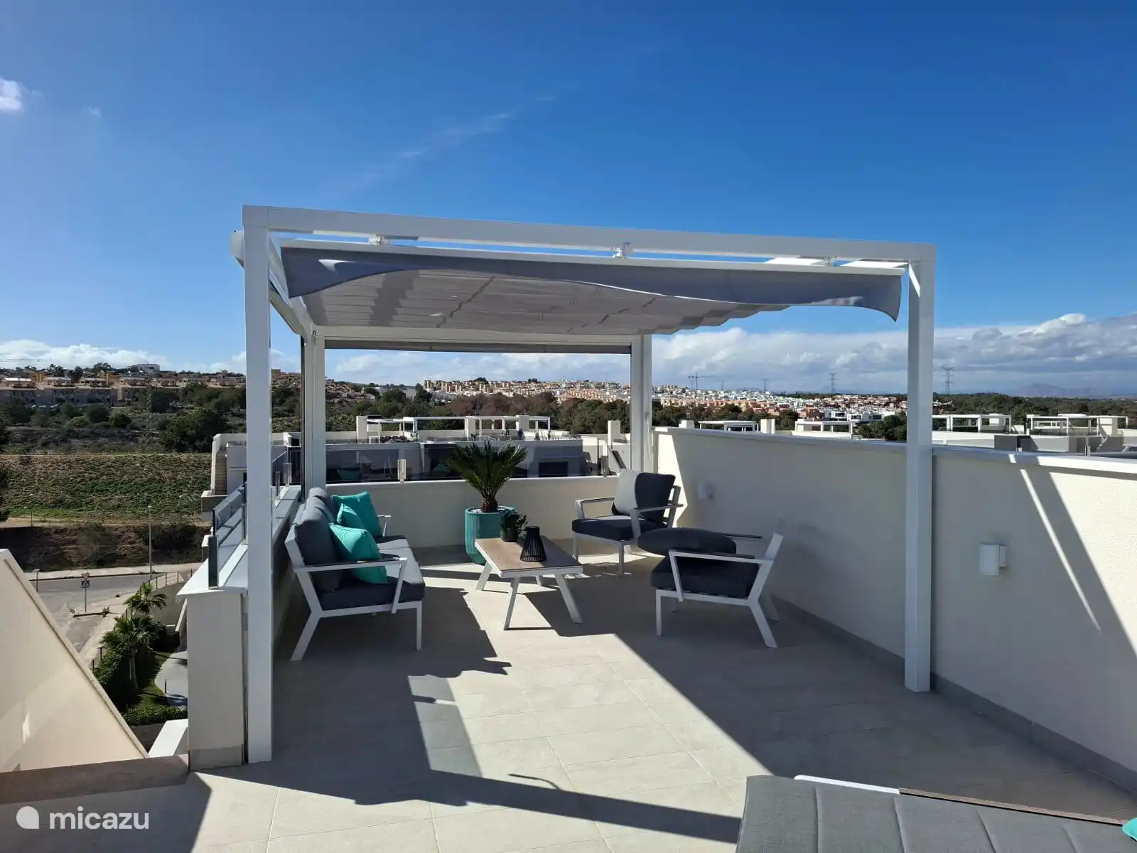 relax lounge sofa with a closed pergola enjoying the surroundings