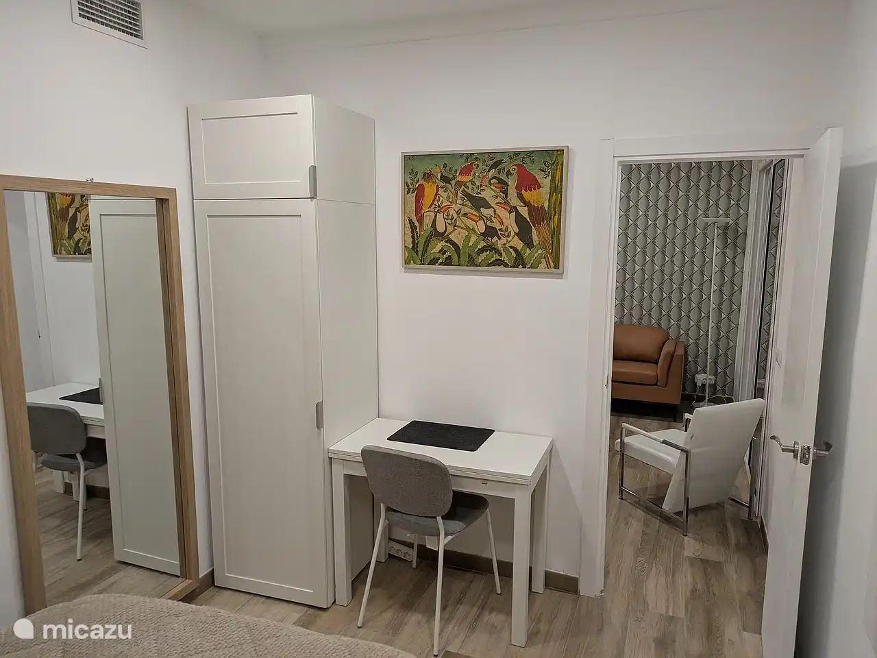 There is also a workplace in the bedroom, with power supply