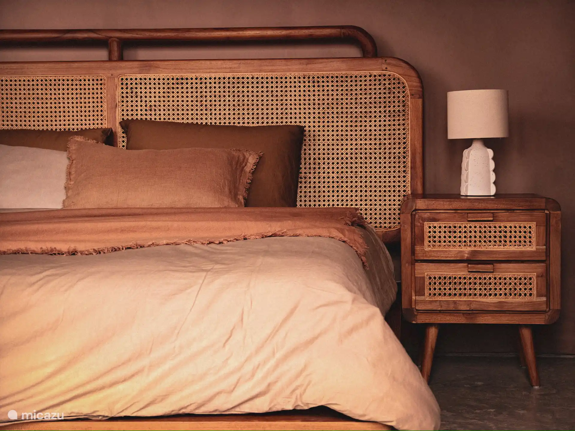 Bedroom in main house in deep earth tones.