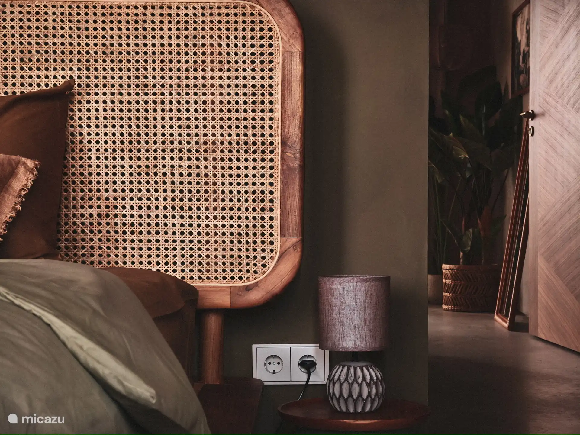 Bedroom in main house in deep shades of green.