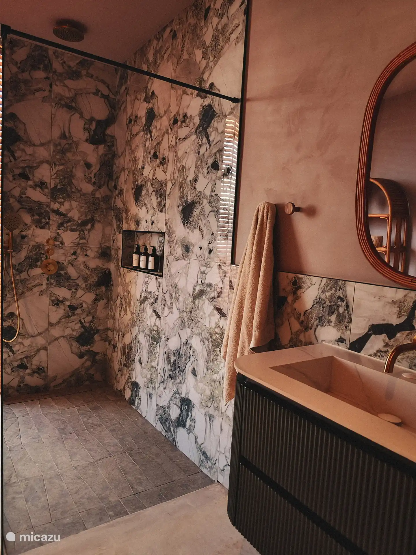 Bathroom with walk-in shower and toilet.