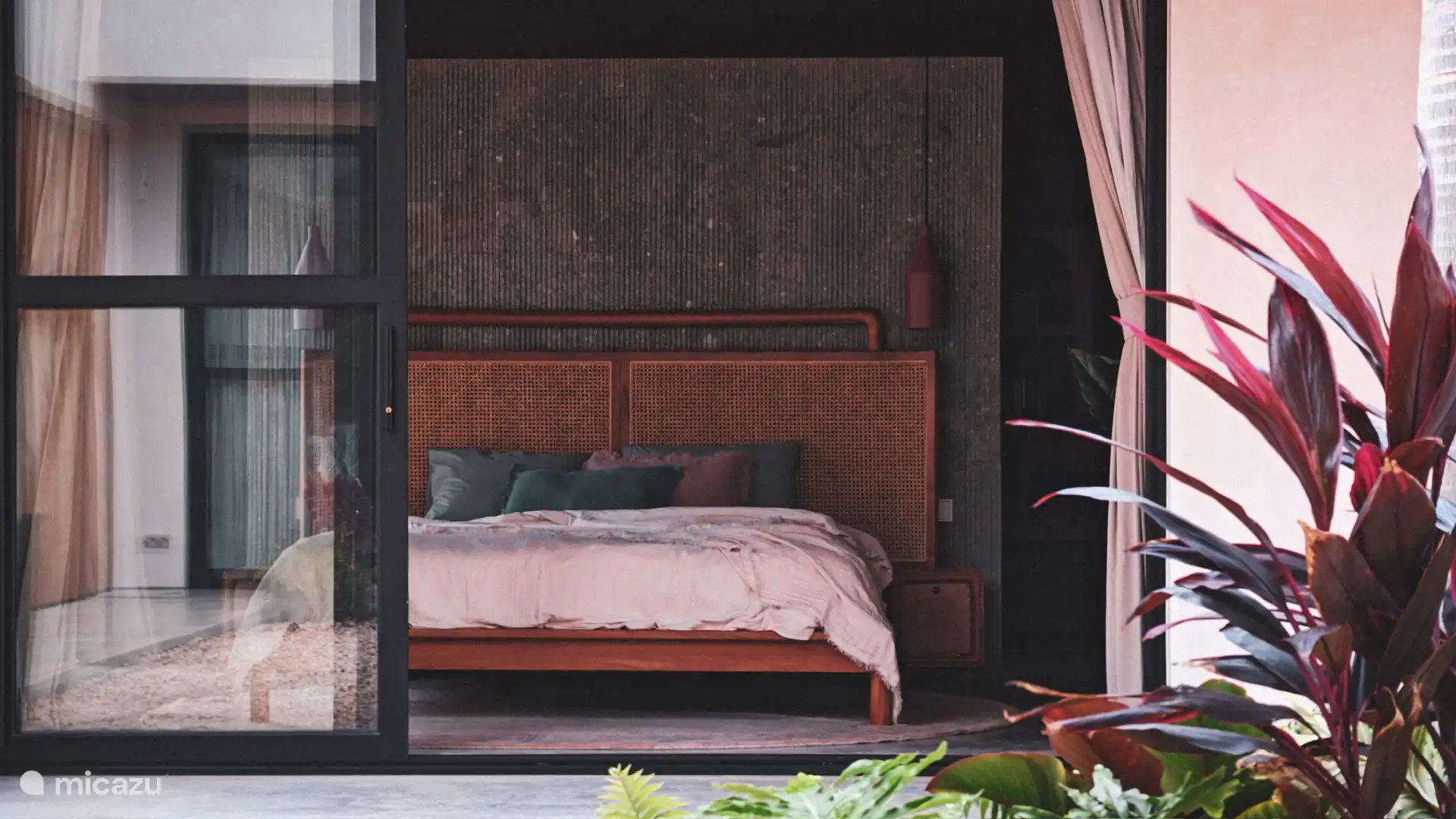 Bedroom overlooking the courtyard garden and ensuite bathroom.