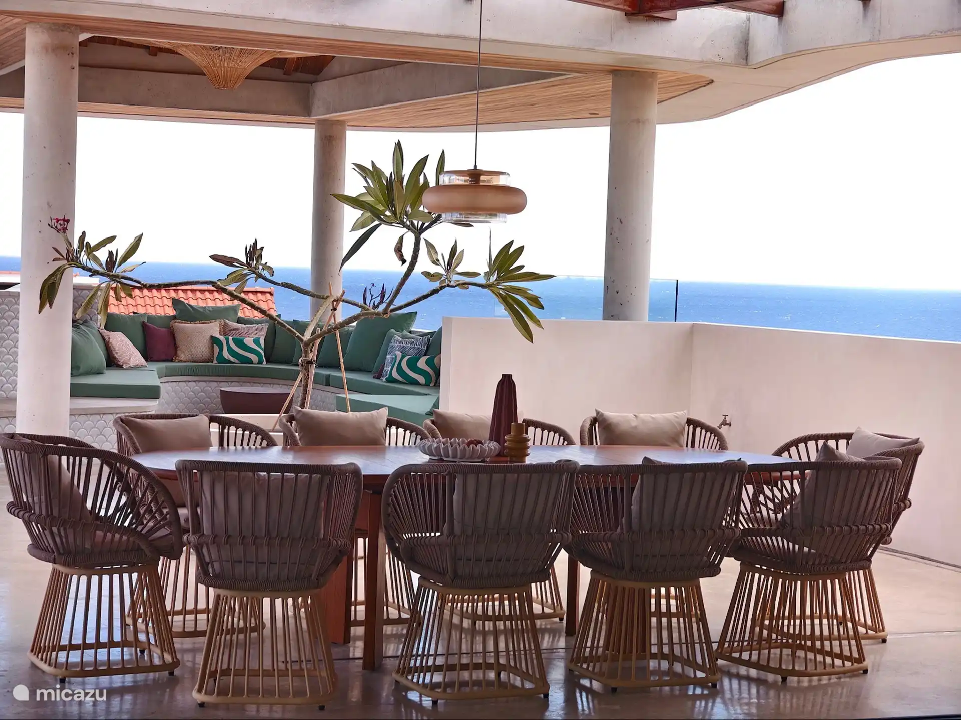 Pool terrace with dining area and palapa lounge.