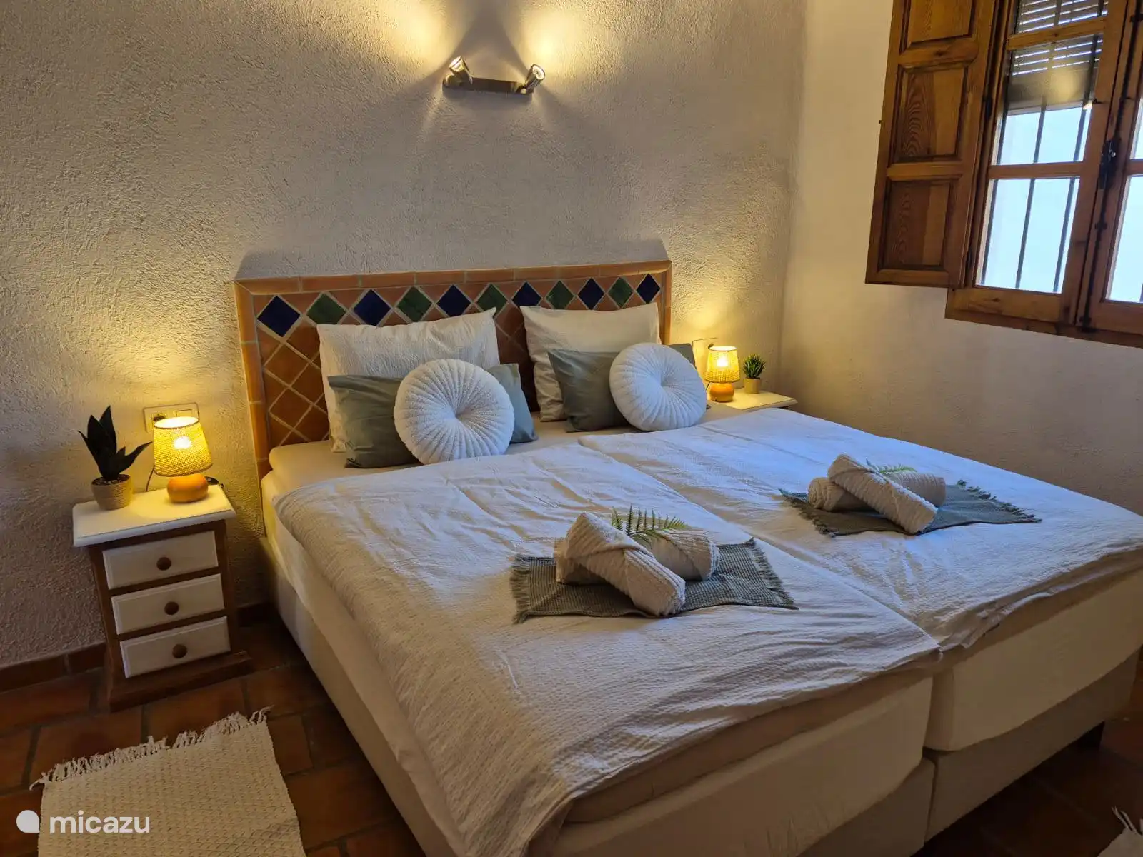 Kingsize boxspring in bedroom.