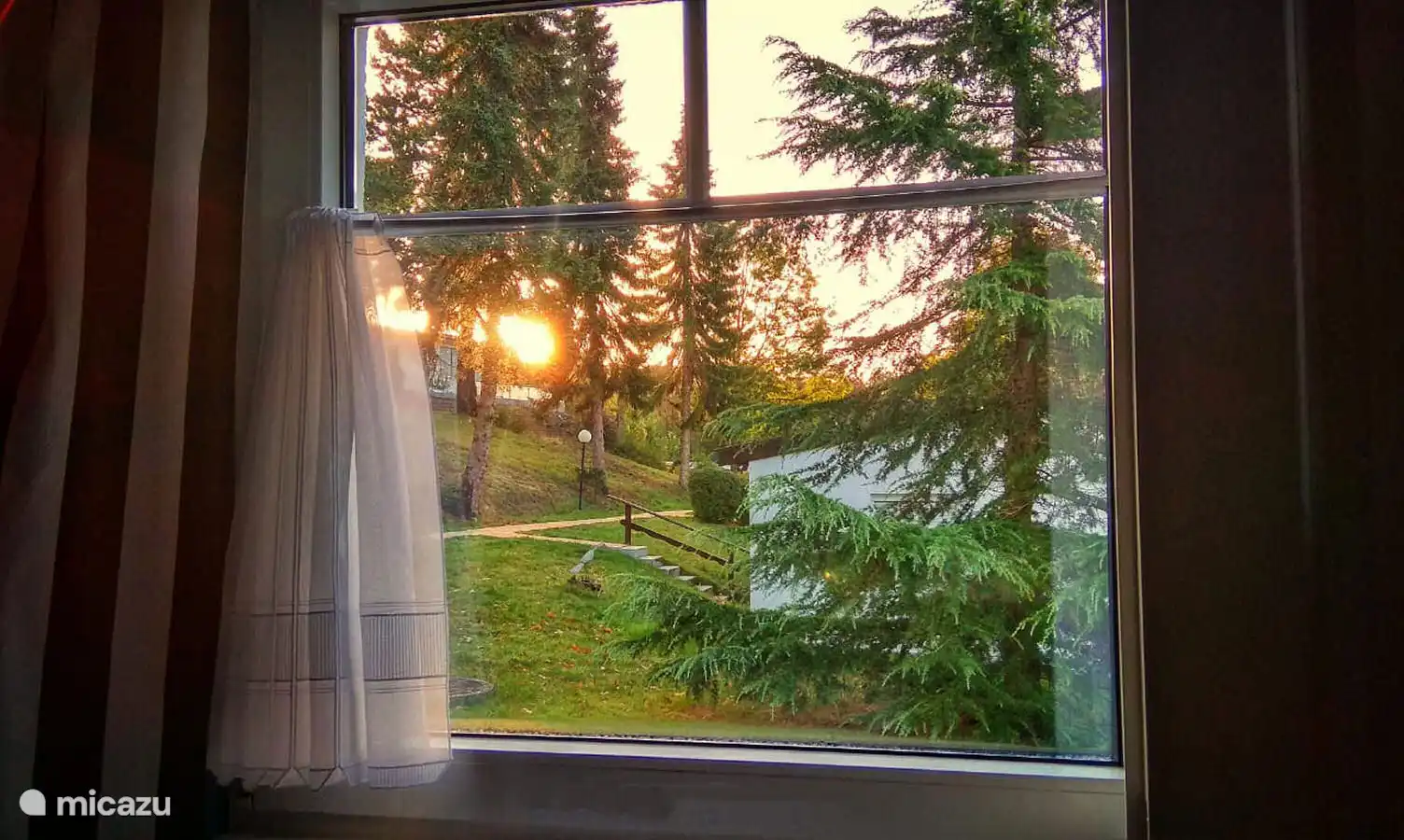 Zonsopgang gezien vanuit het slaapkamerraam