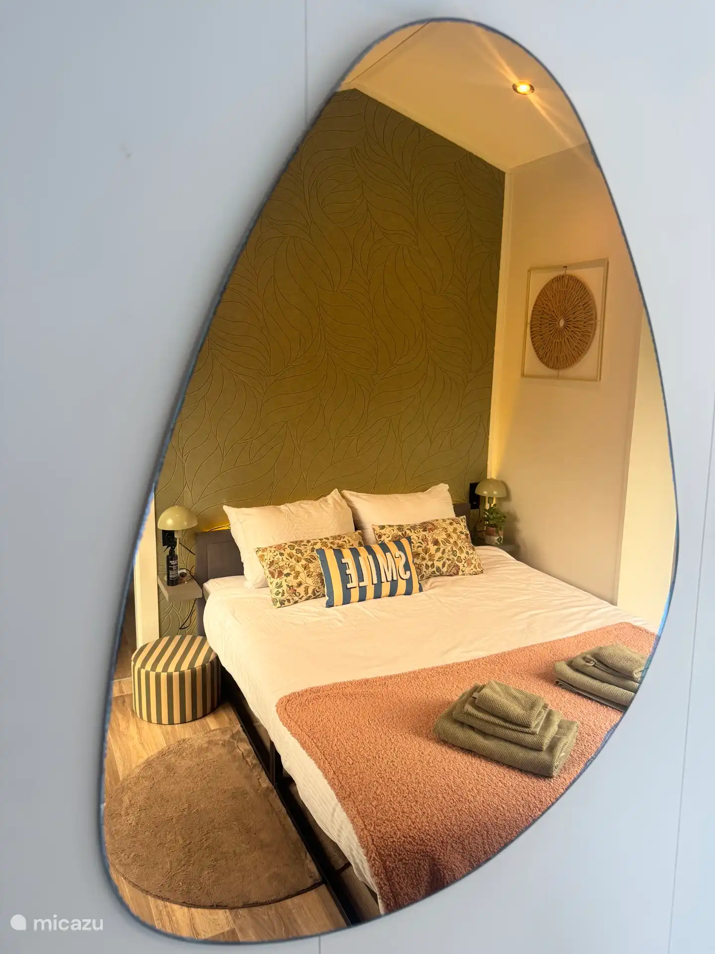 Luxurious large bedroom with air conditioning and high large windows overlooking the greenery 