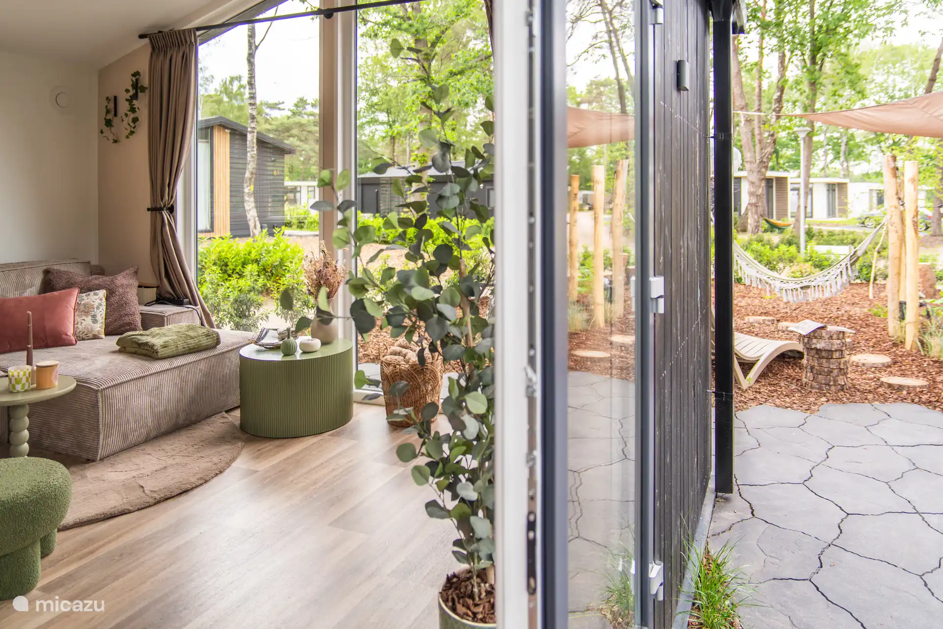 Living room and patio doors to the private garden with a screen door 
